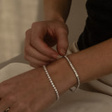 Round Cut Diamond Tennis Bracelet in Enlargement Setting