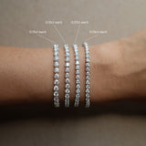 Round Cut Diamond Tennis Bracelet in Enlargement Setting