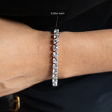 Round Cut Diamond Tennis Bracelet in Enlargement Setting