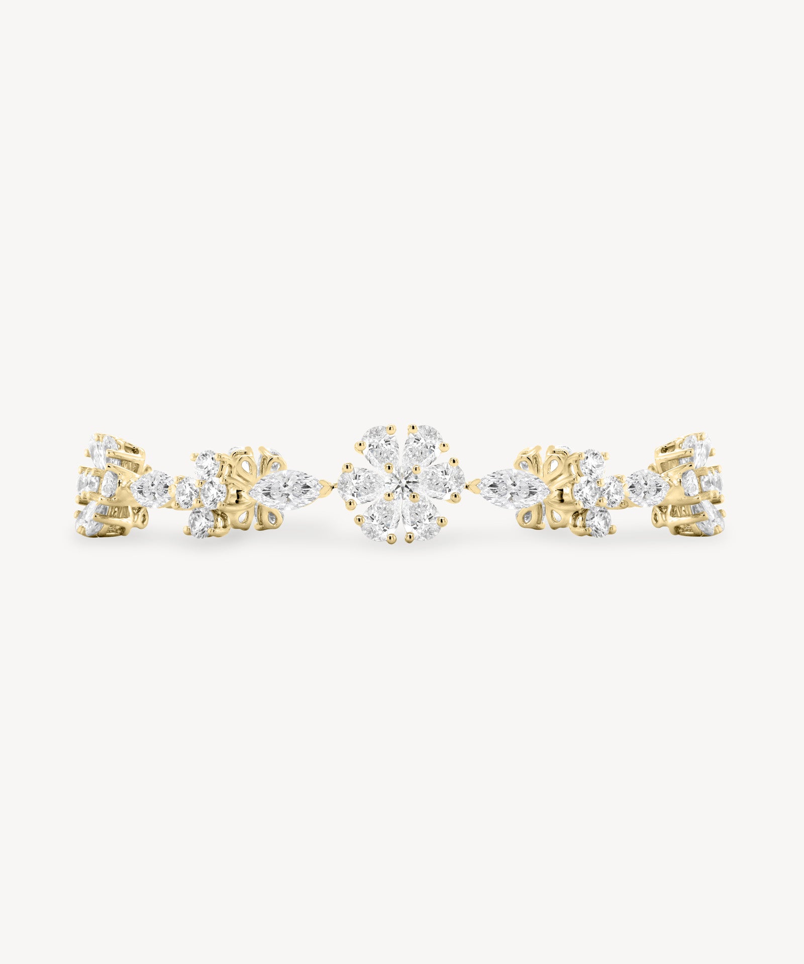 Diamond flower station bracelet in yellow gold