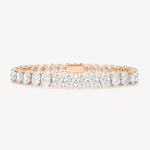 Oval cut diamond tennis bracelet in four-prong setting in rose gold