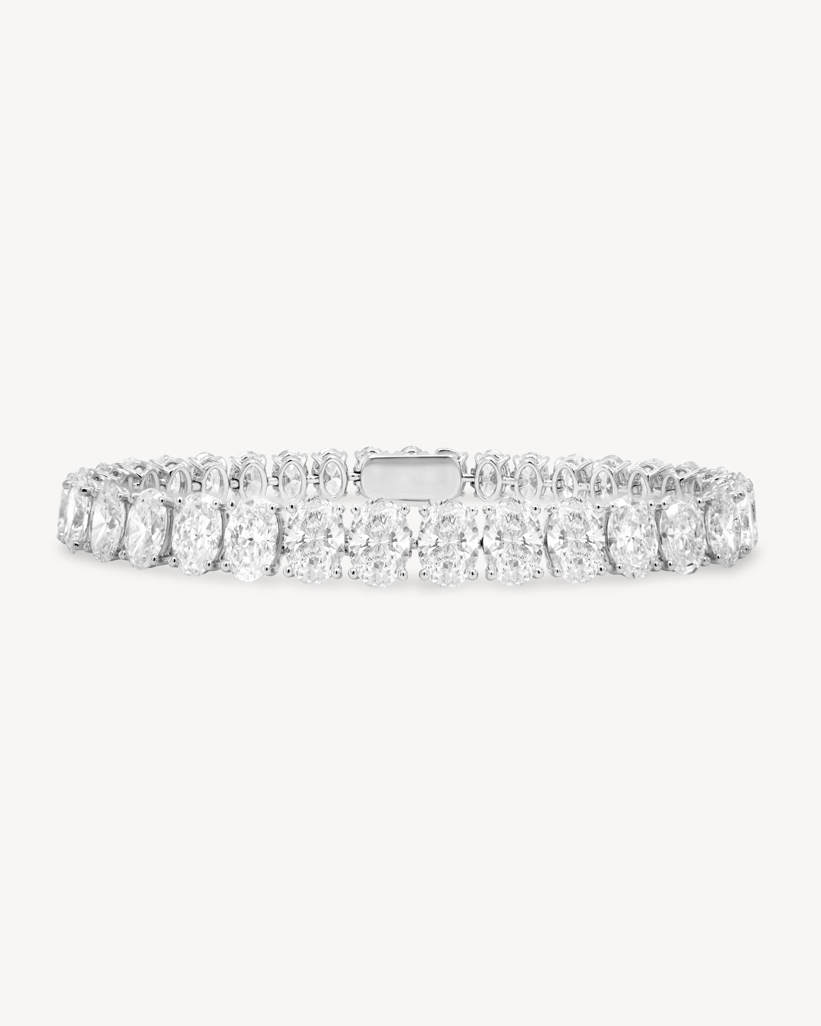 Oval cut diamond tennis bracelet in four-prong setting in white gold