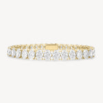 Oval cut diamond tennis bracelet in four-prong setting in yellow gold