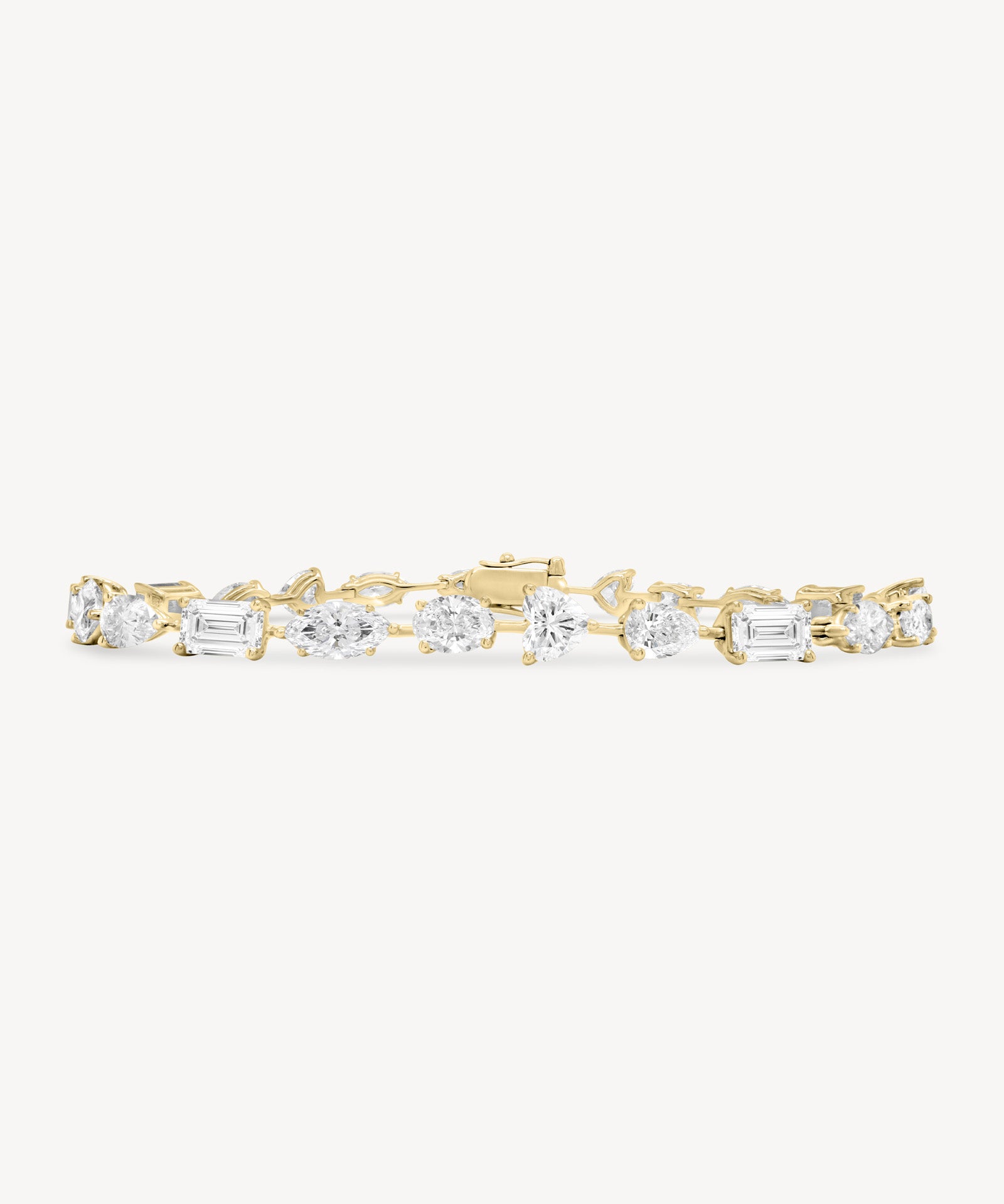 Alternating fancy cut diamond bracelet in yellow gold