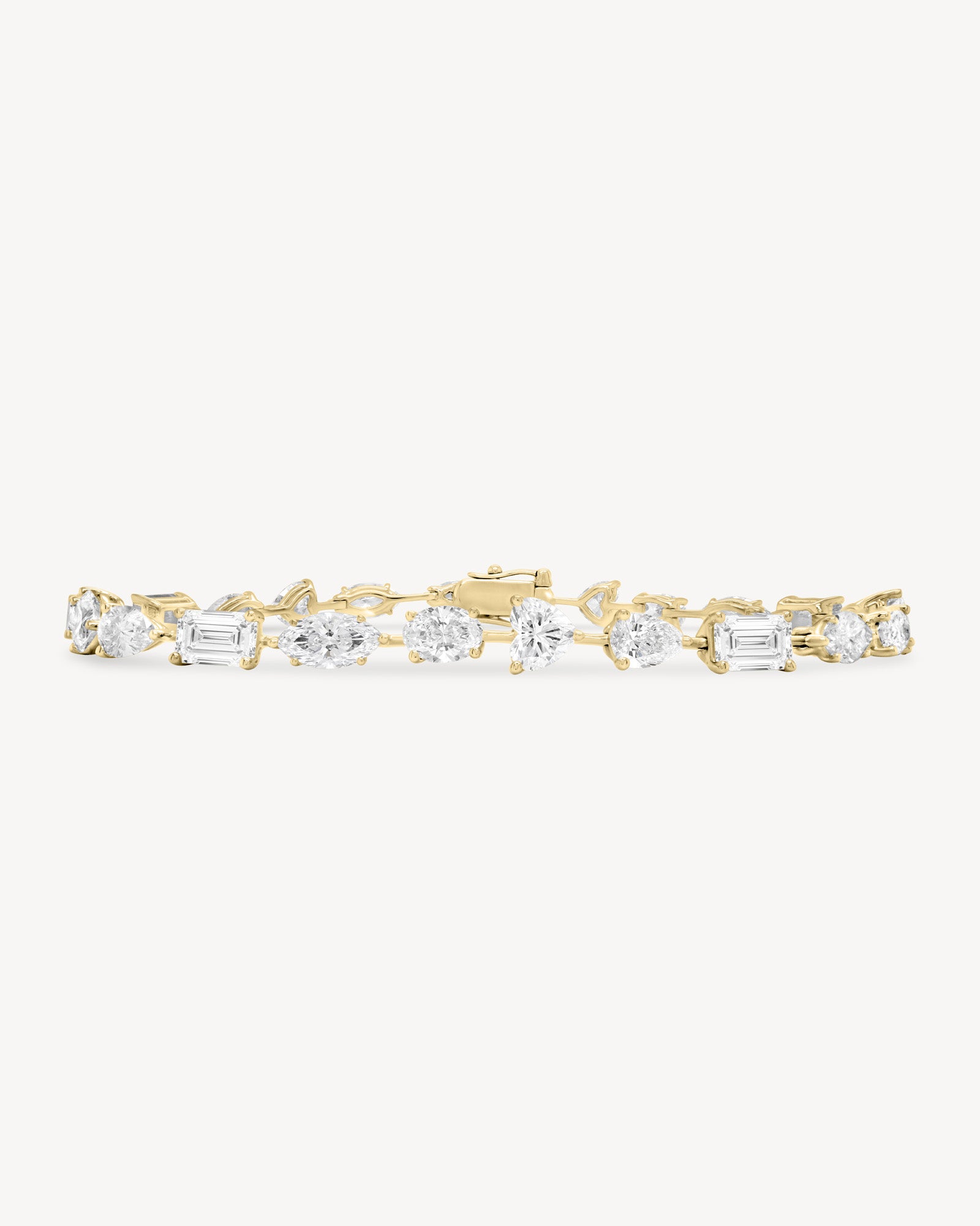 Alternating fancy cut diamond bracelet in yellow gold