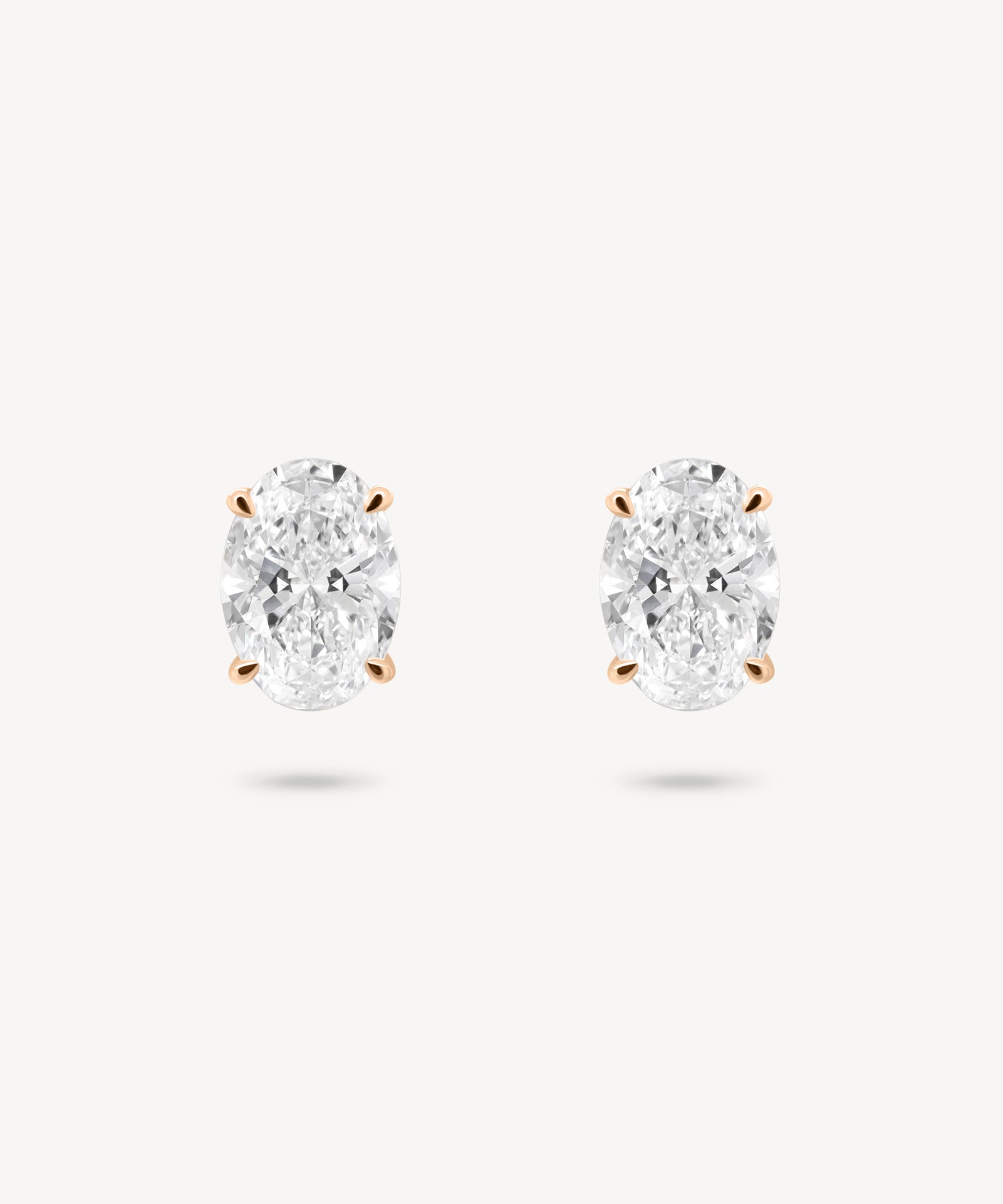 Oval Cut Diamond Solitaire Stud Earrings