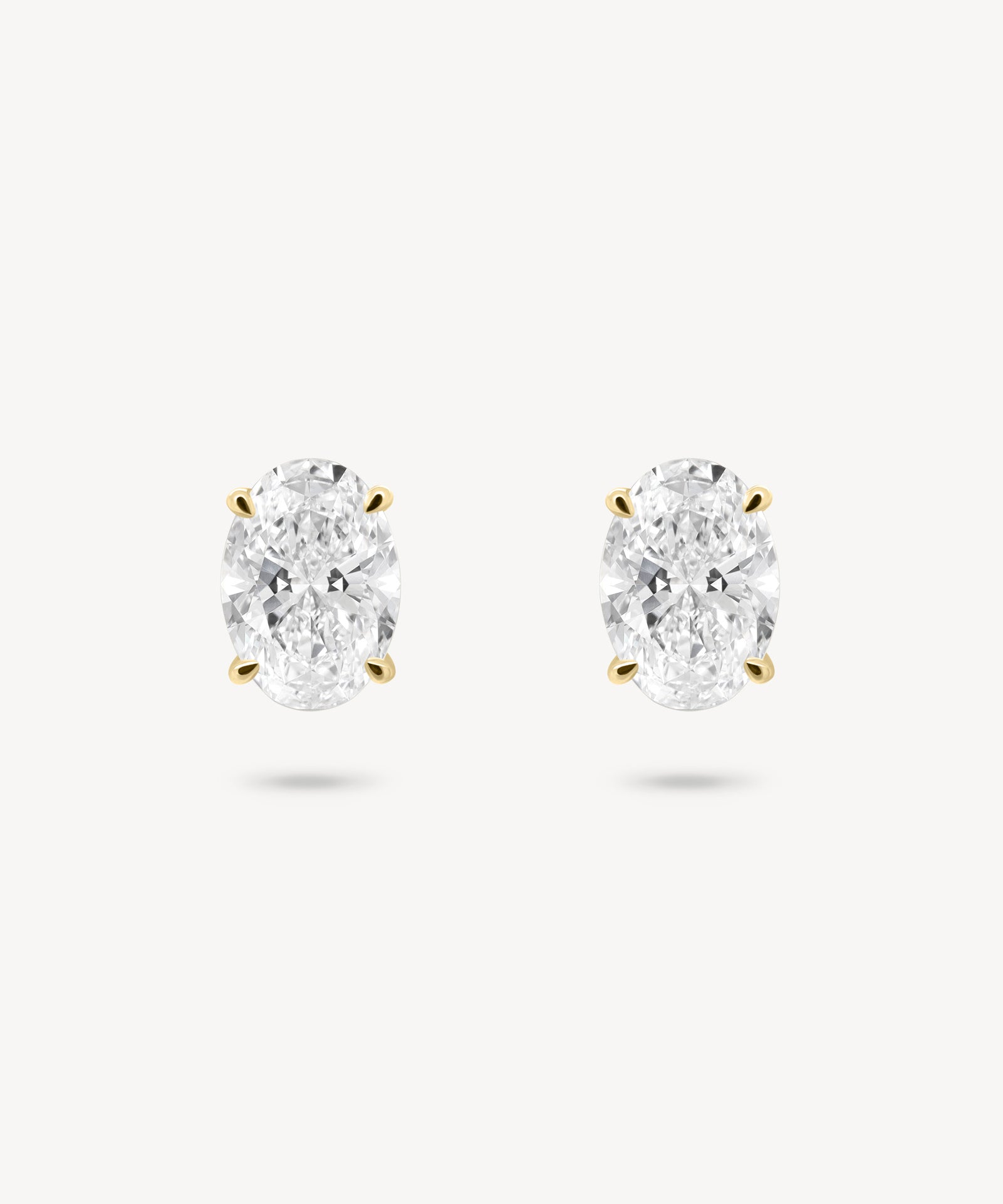 Oval Cut Diamond Solitaire Stud Earrings