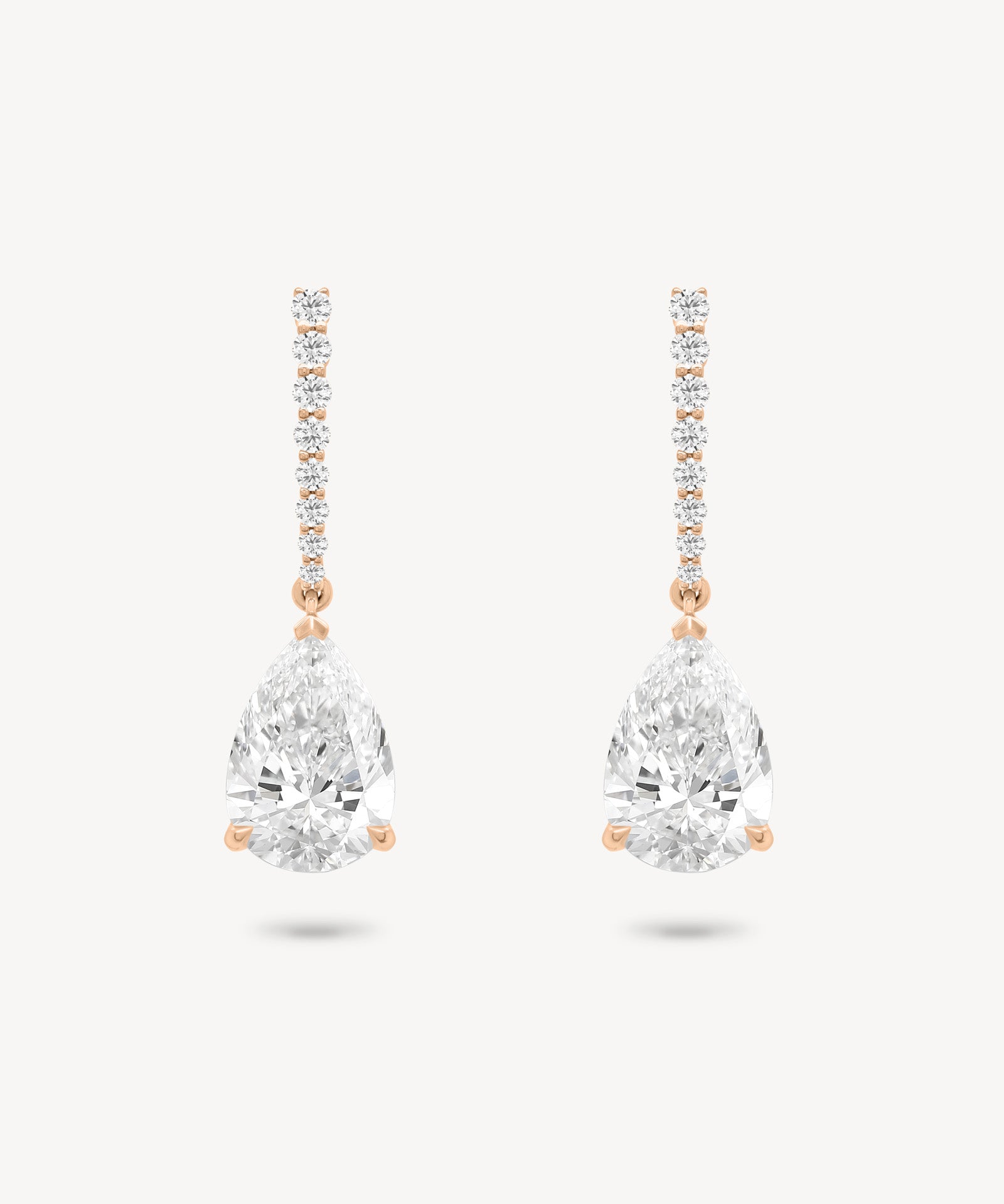 Pear cut diamond drop earring in rose gold