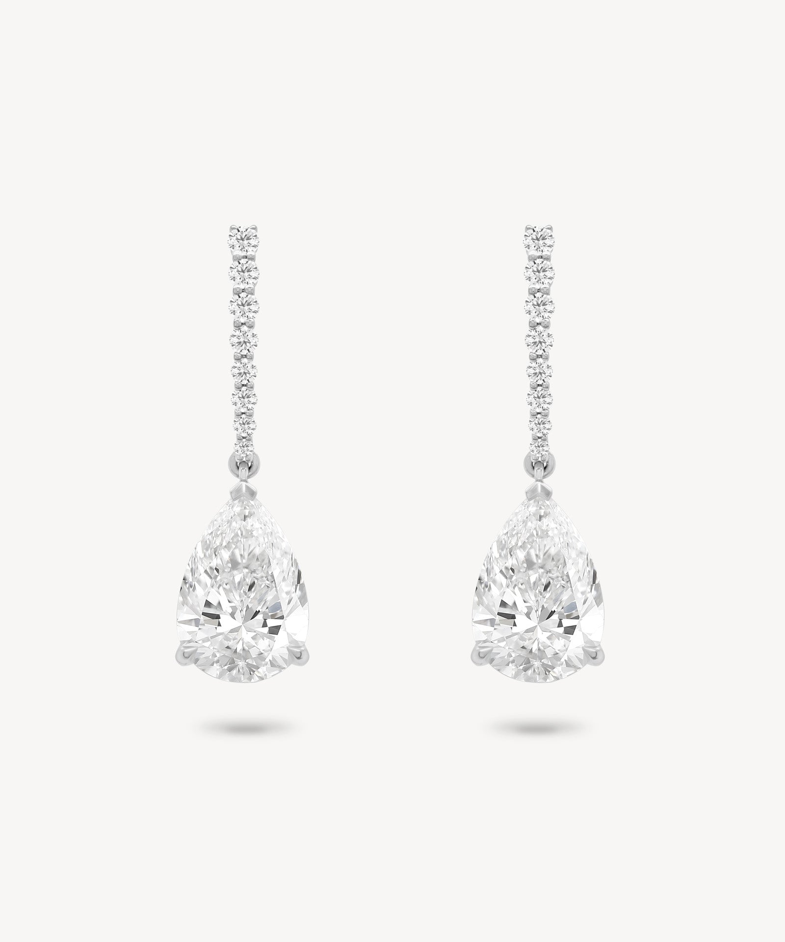 Pear cut diamond drop earring in white gold