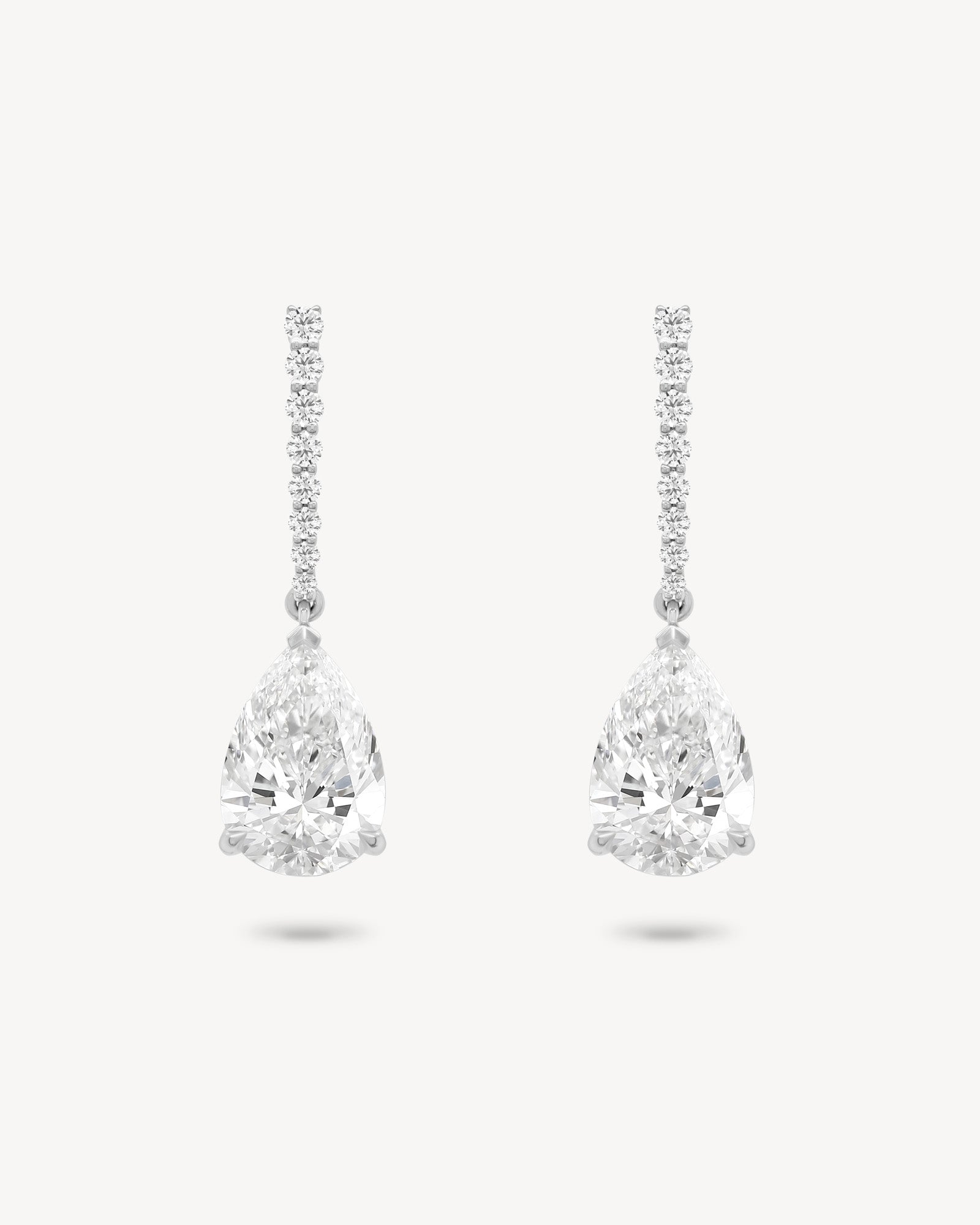 Pear cut diamond drop earring in white gold