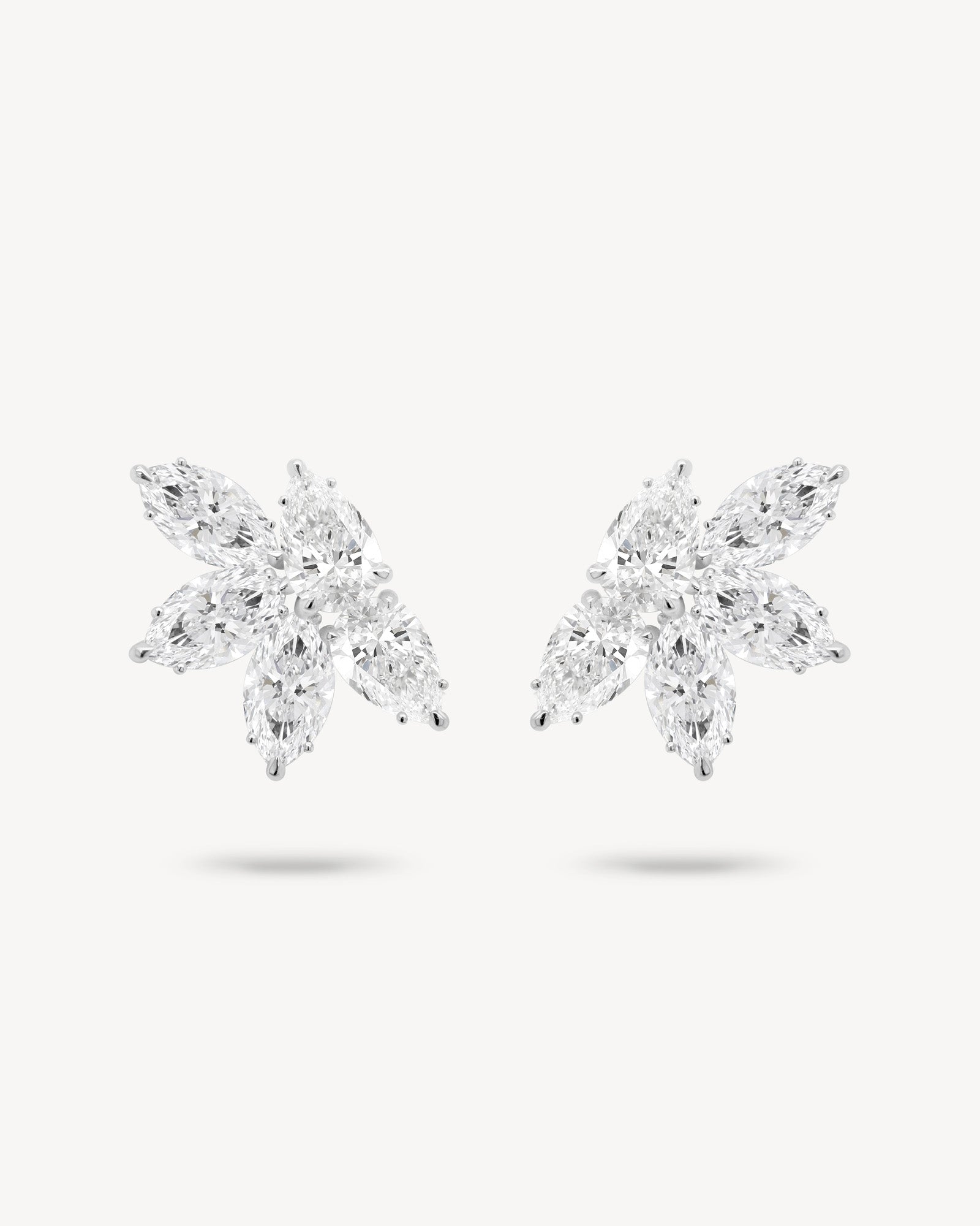 Marquise and pear cut diamond cluster stud earrings in white gold