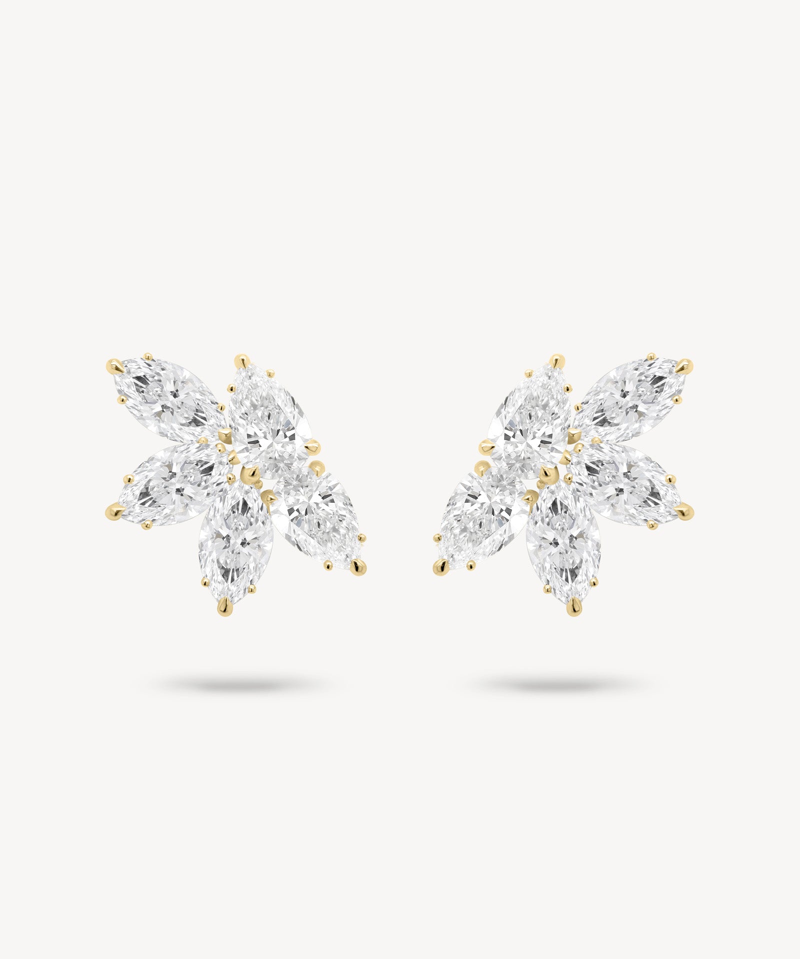 Marquise and pear cut diamond cluster stud earrings in yellow gold