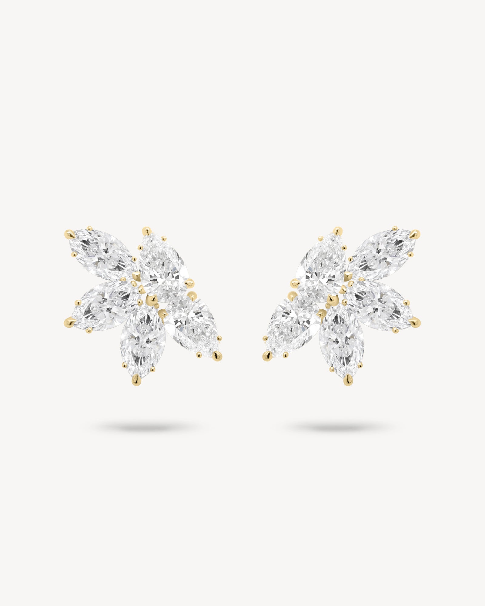 Marquise and pear cut diamond cluster stud earrings in yellow gold