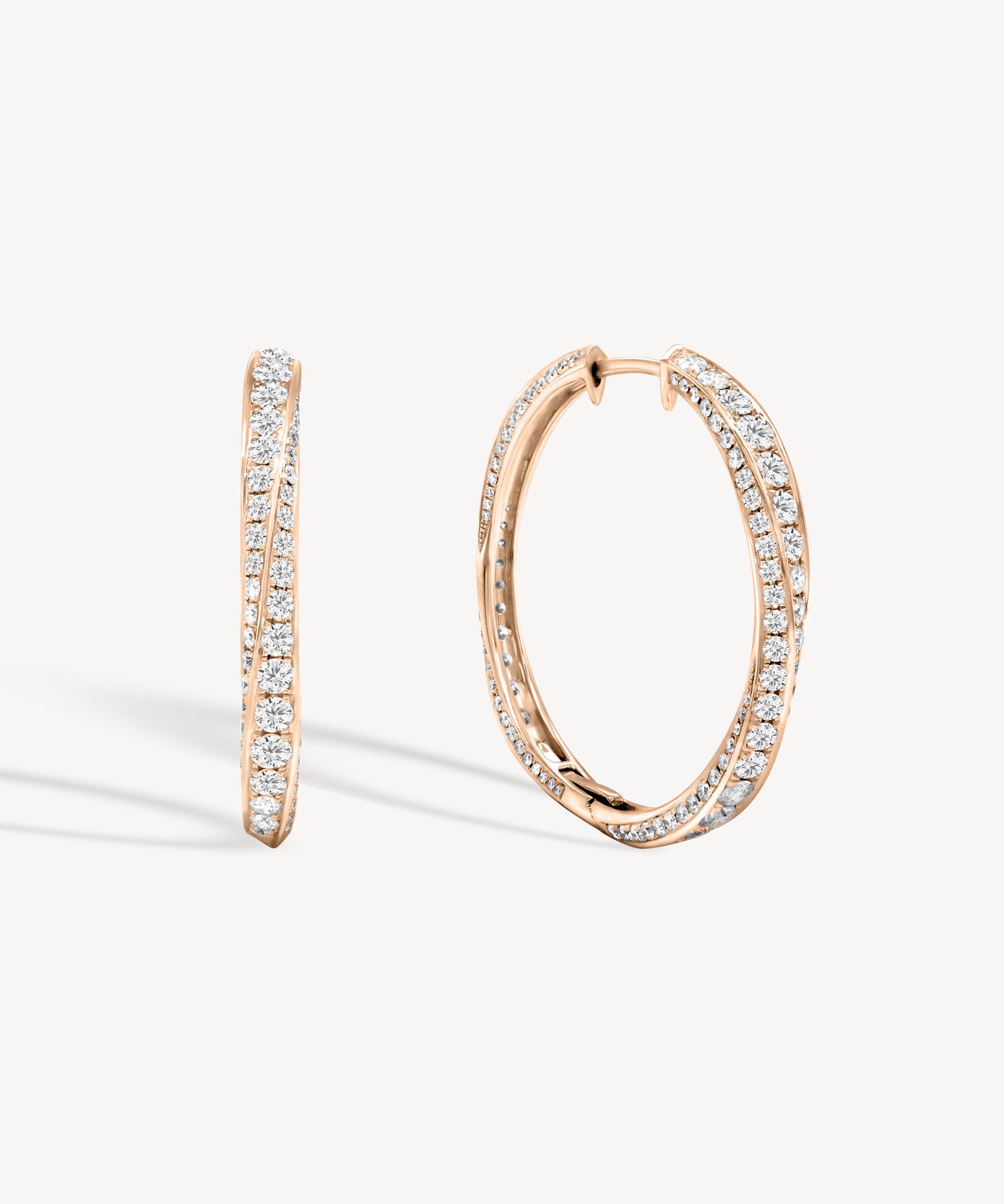 Spiral round cut diamond hoop earring in rose gold