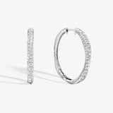 Spiral round cut diamond hoop earring in white gold