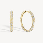 Spiral round cut diamond hoop earring in yellow gold