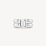 Emerald Cut diamond double gold band ring in 18K white gold set against a white background