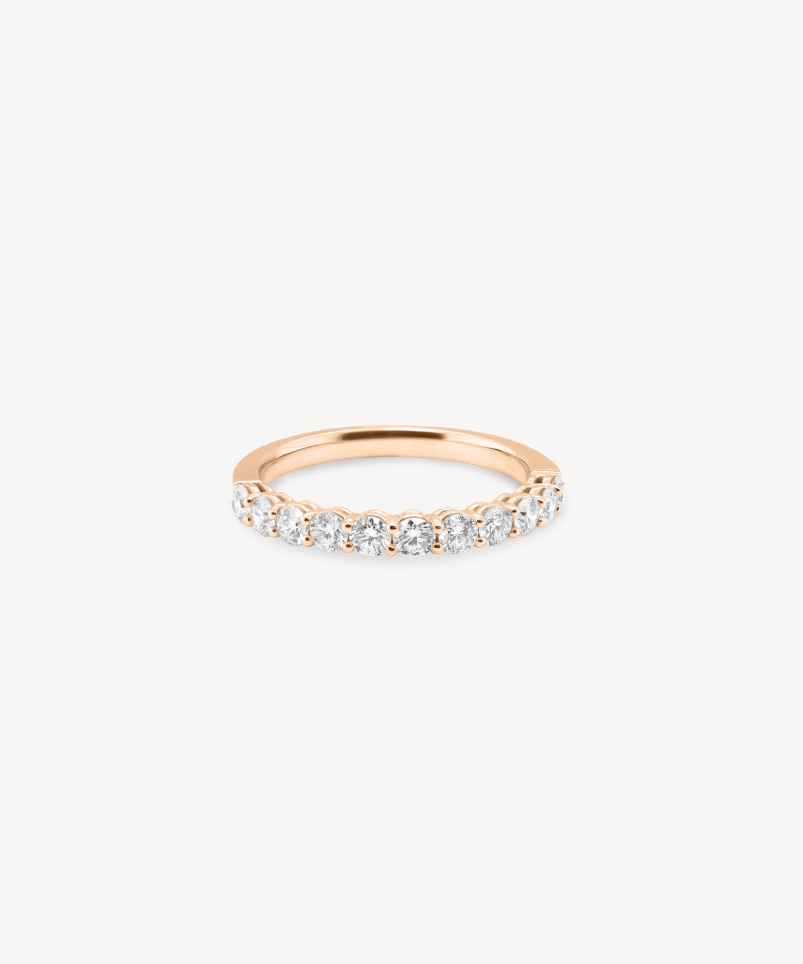 Round Cut Diamond Half Eternity Ring in Shared Prong Setting