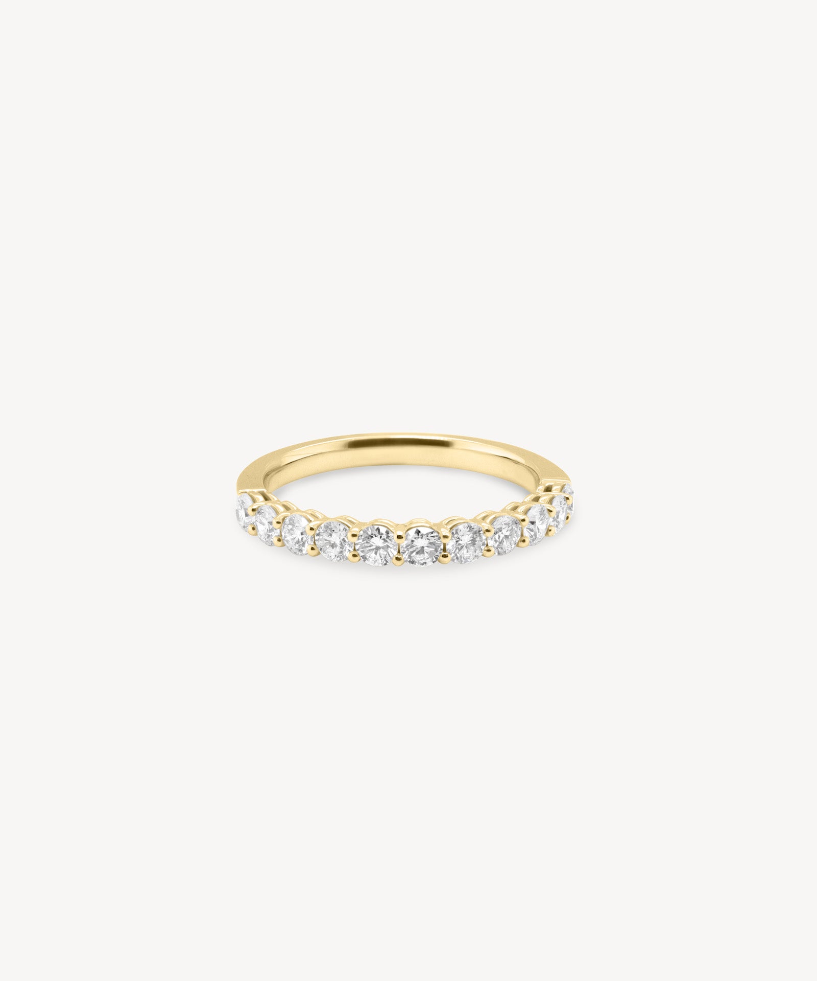 Round Cut Diamond Half Eternity Ring in Shared Prong Setting