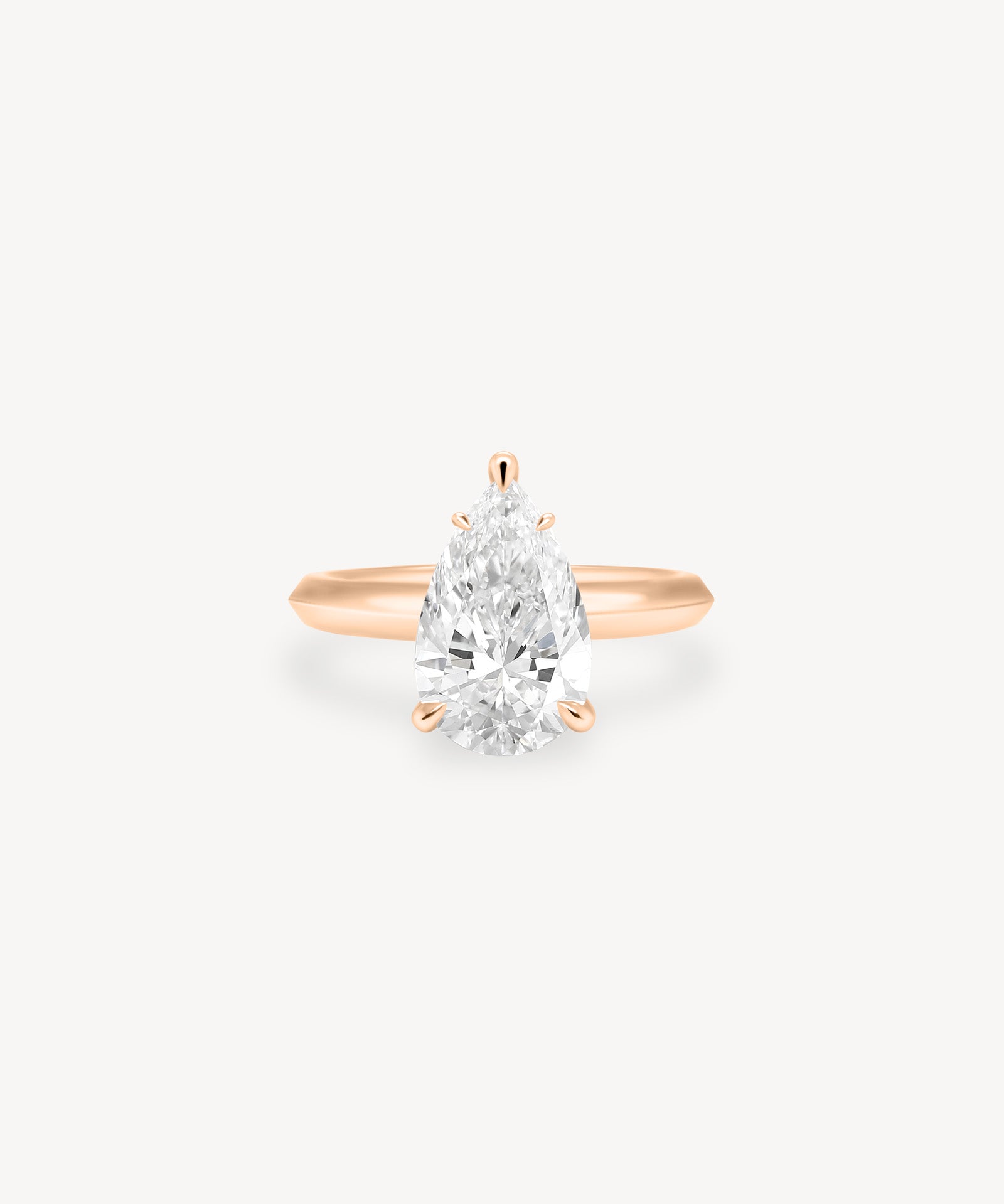 Pear Cut Solitaire Ring in Knife Edge Setting