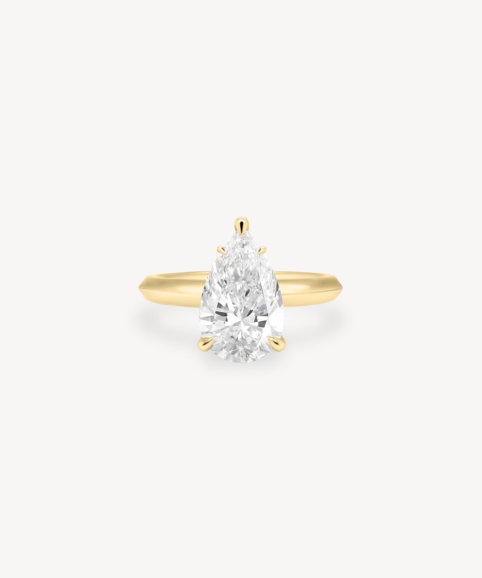 Pear Cut Solitaire Ring in Knife Edge Setting