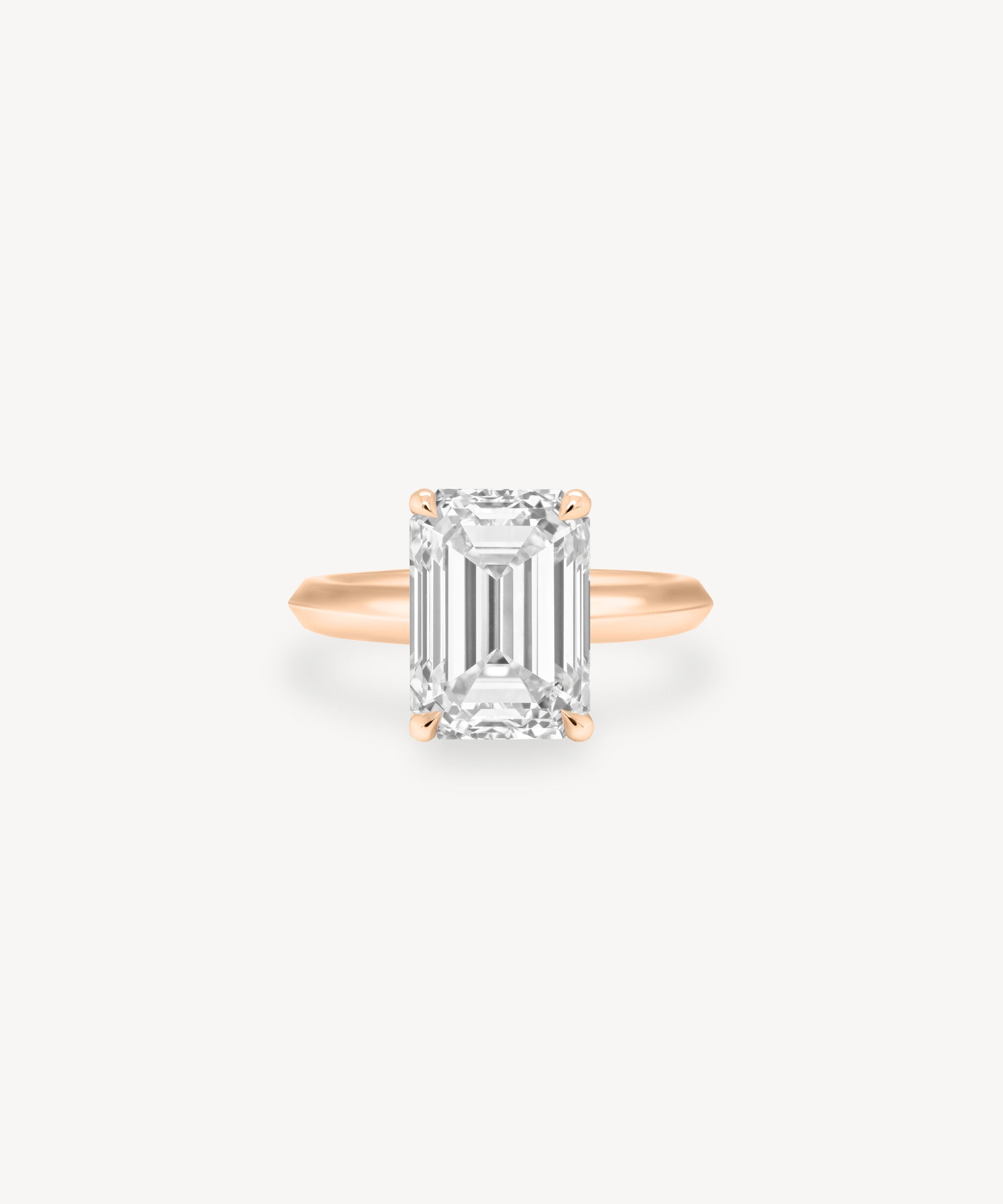 Emerald Cut Solitaire Ring in Knife Edge Setting