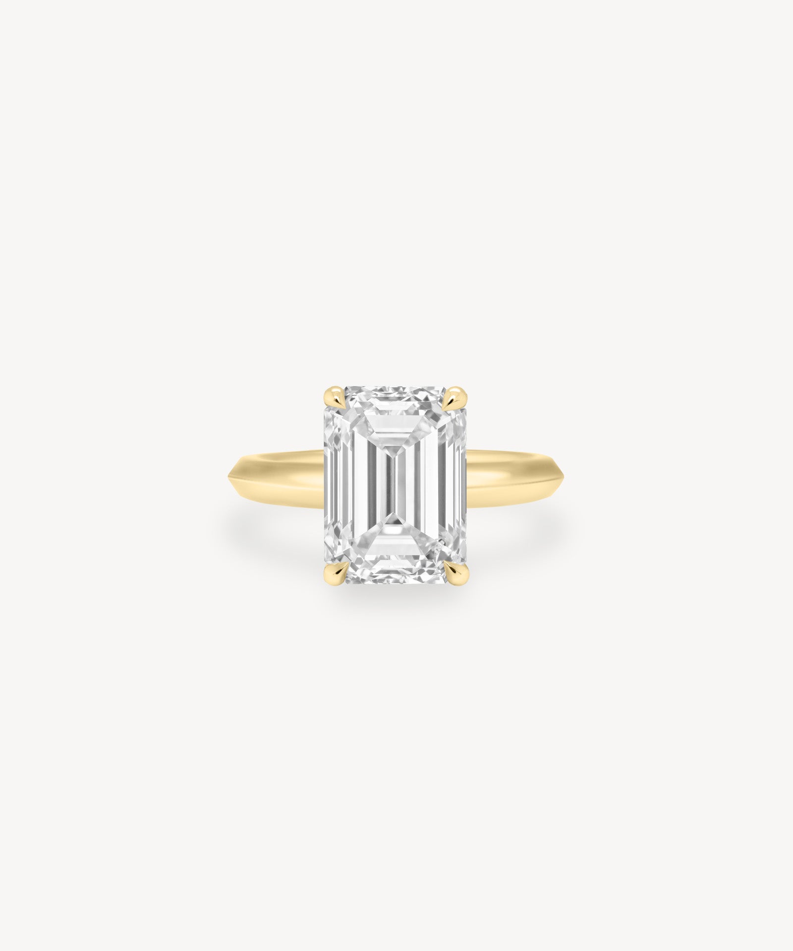 Emerald Cut Solitaire Ring in Knife Edge Setting