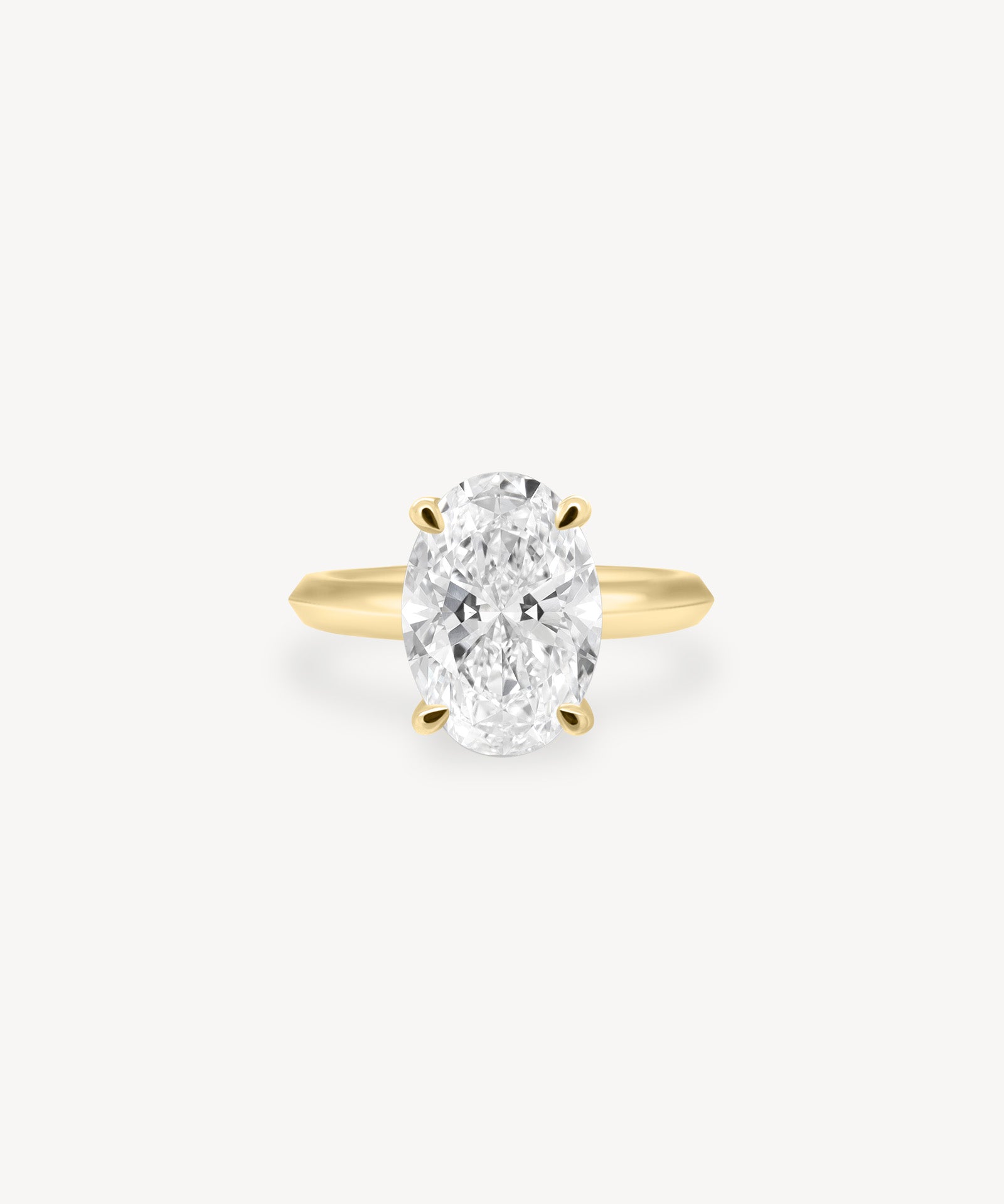 Oval Cut Solitaire Ring in Knife Edge Setting