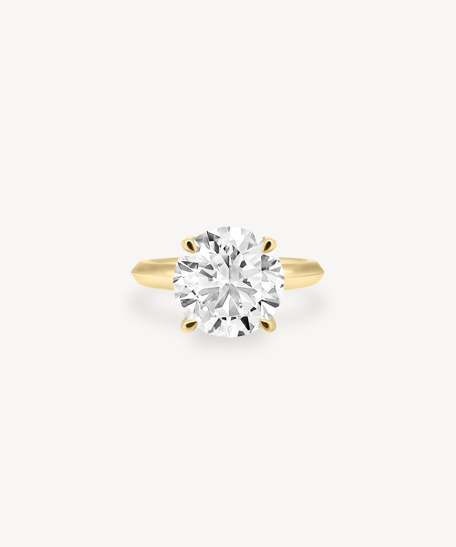 Round Cut Solitaire Ring in Knife Edge Setting