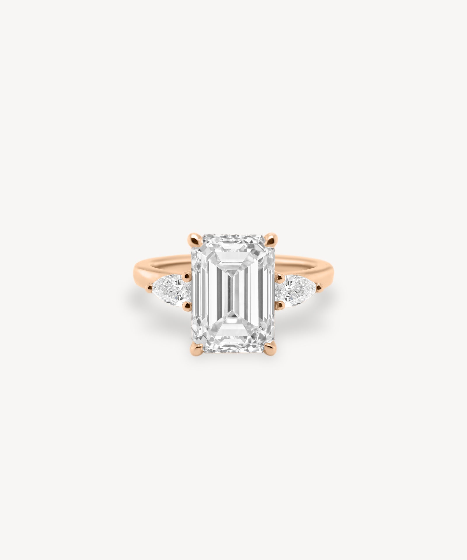 Emerald Cut Diamond Three Stone Ring With Pear Cut Side Stones