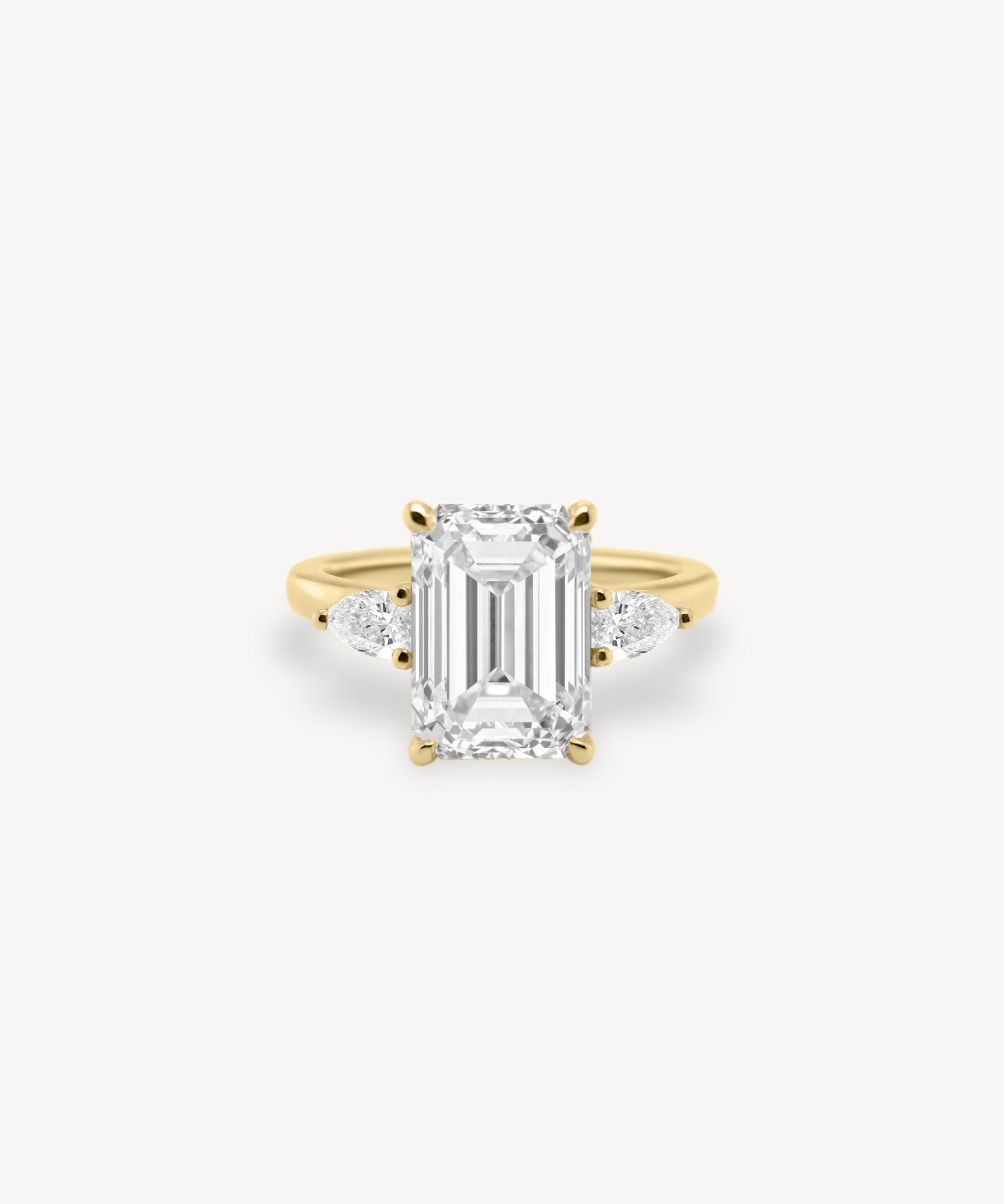 Emerald Cut Diamond Three Stone Ring With Pear Cut Side Stones