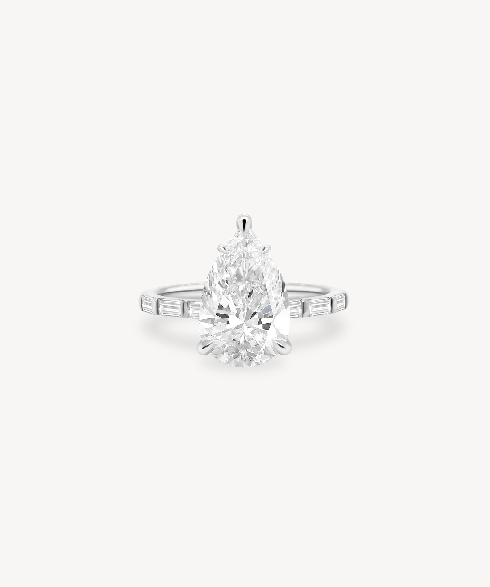 Pear and Baguette Cut Diamond Ring in Bar Setting