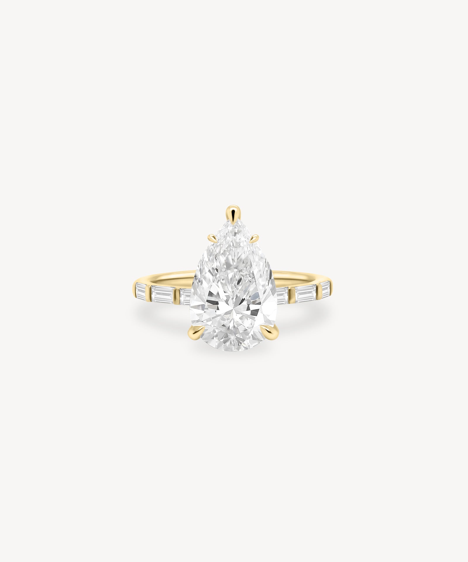 Pear and Baguette Cut Diamond Ring in Bar Setting