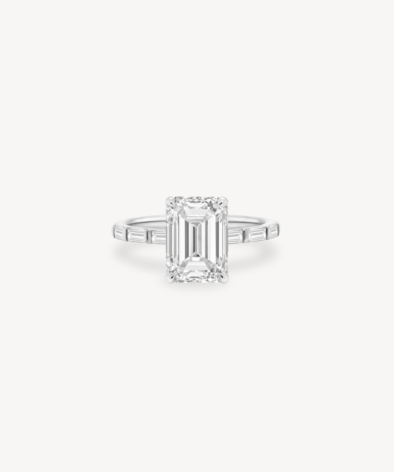 Emerald and Baguette Cut Diamond Ring in Bar Setting