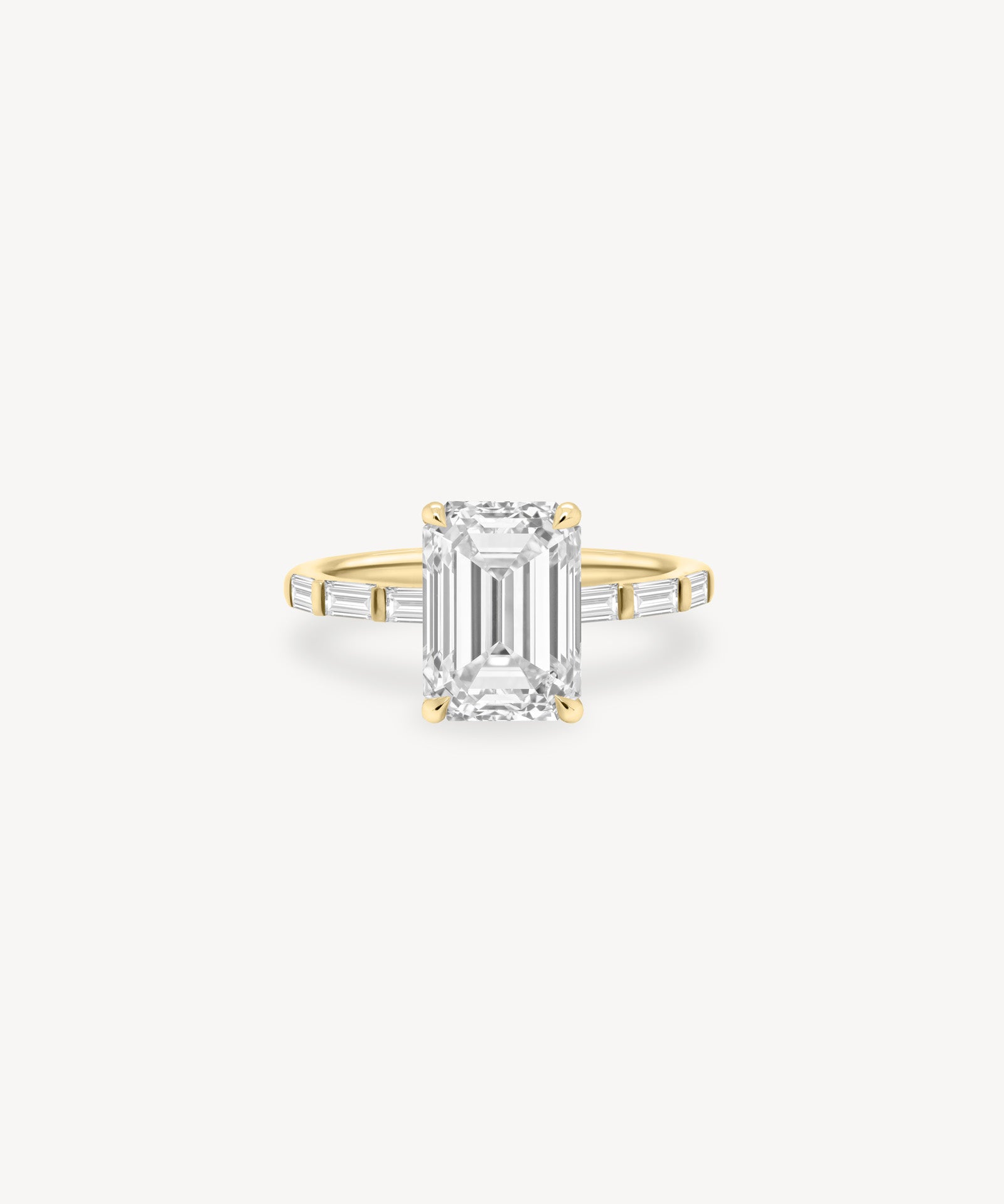 Emerald and Baguette Cut Diamond Ring in Bar Setting