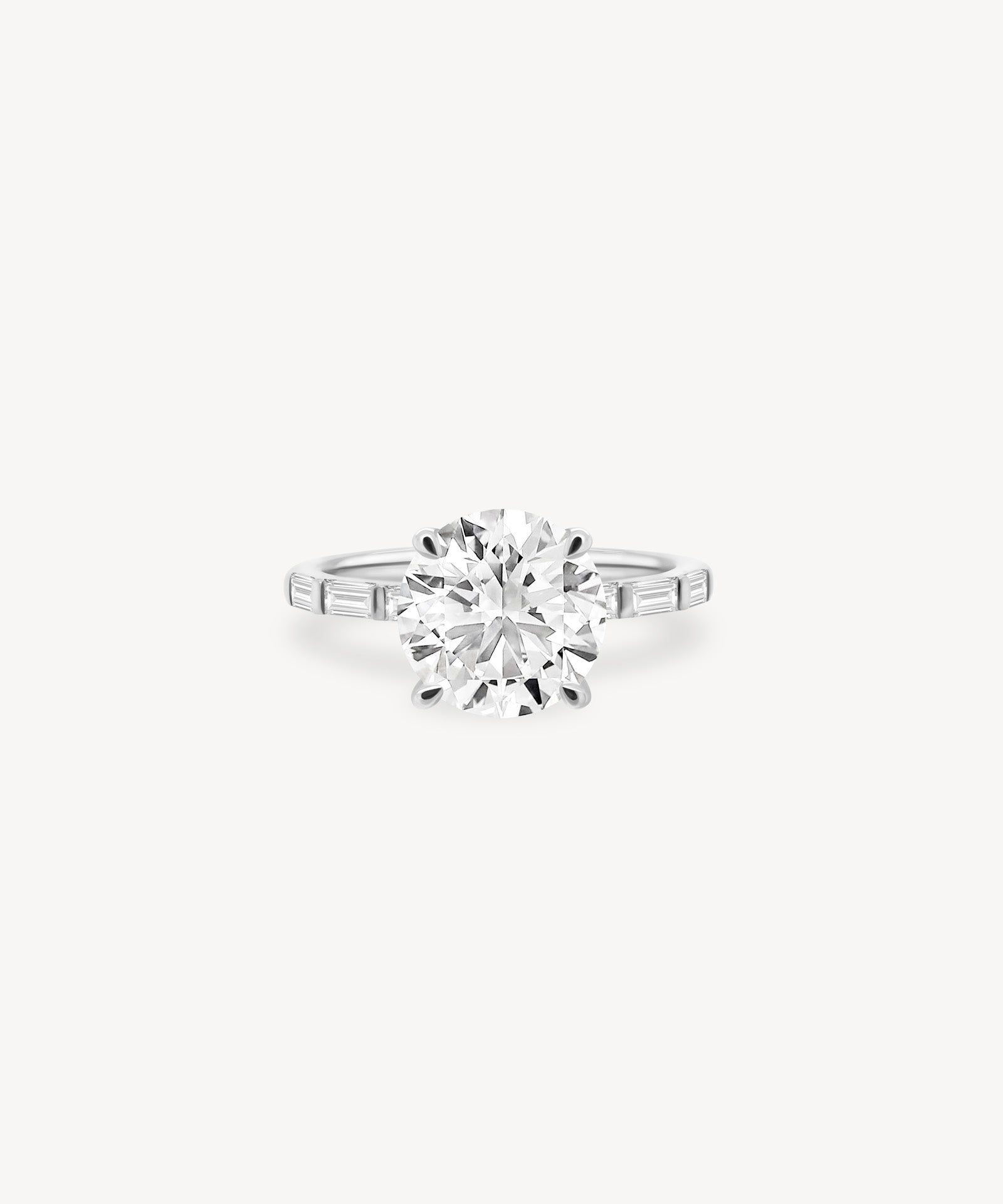 Round and Baguette Cut Diamond Ring in Bar Setting
