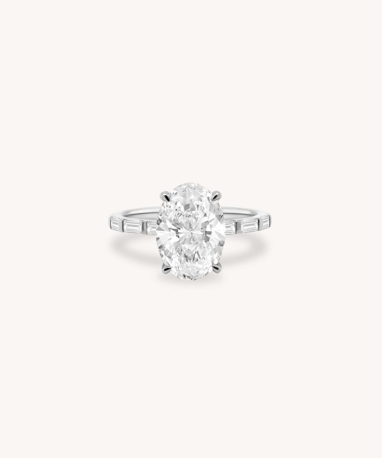 Oval and Baguette Cut Diamond Ring in Bar Setting