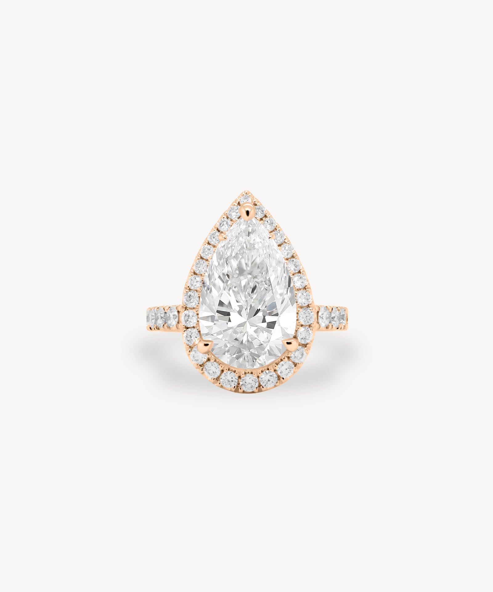Pear Cut Diamond Halo Pavé Ring in Cathedral Setting