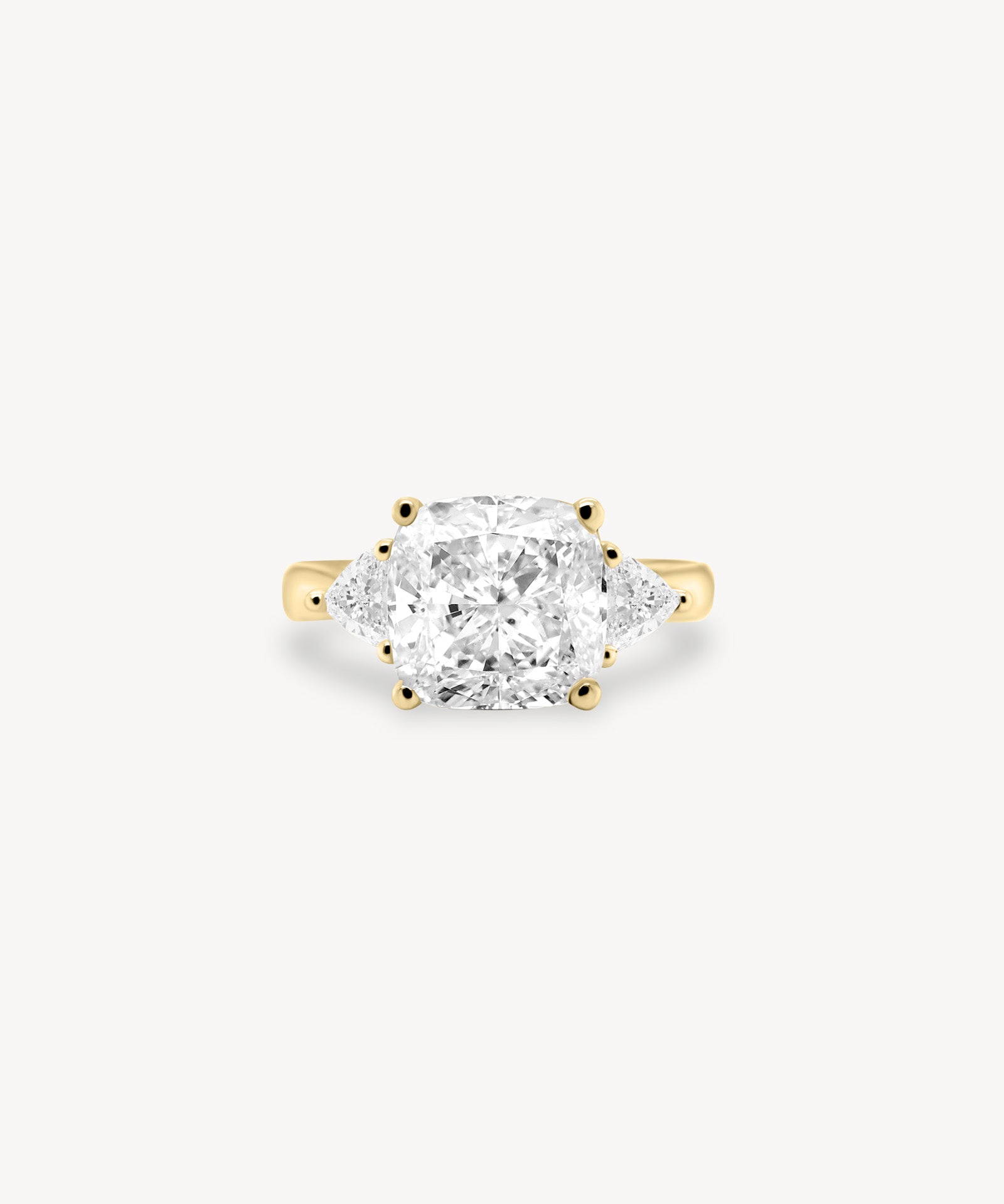 Cushion Cut Diamond Three Stone Ring With Trillion Cut Side Stones