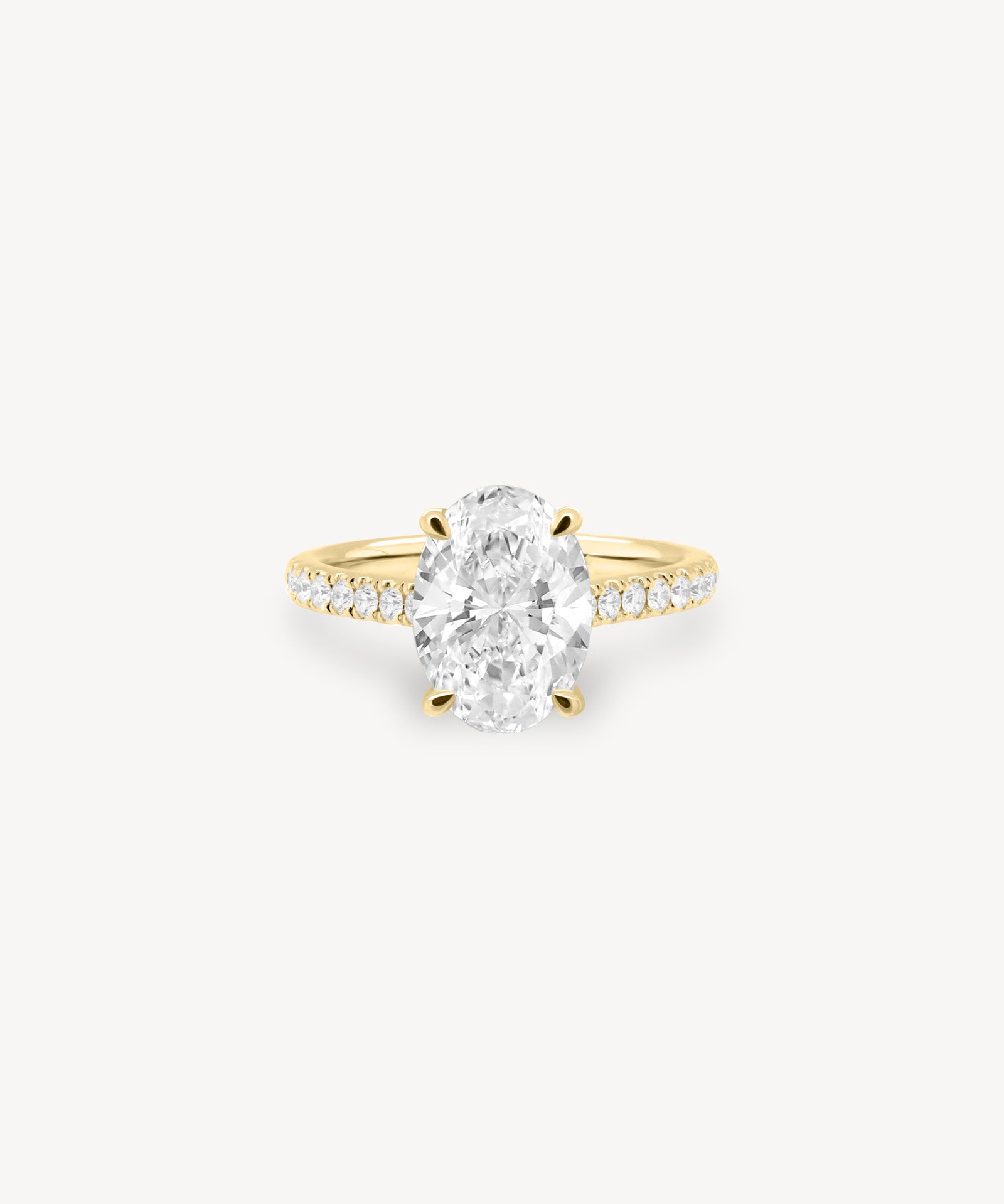 Oval Cut Diamond Pavé Ring in Cathedral Setting with Hidden Halo