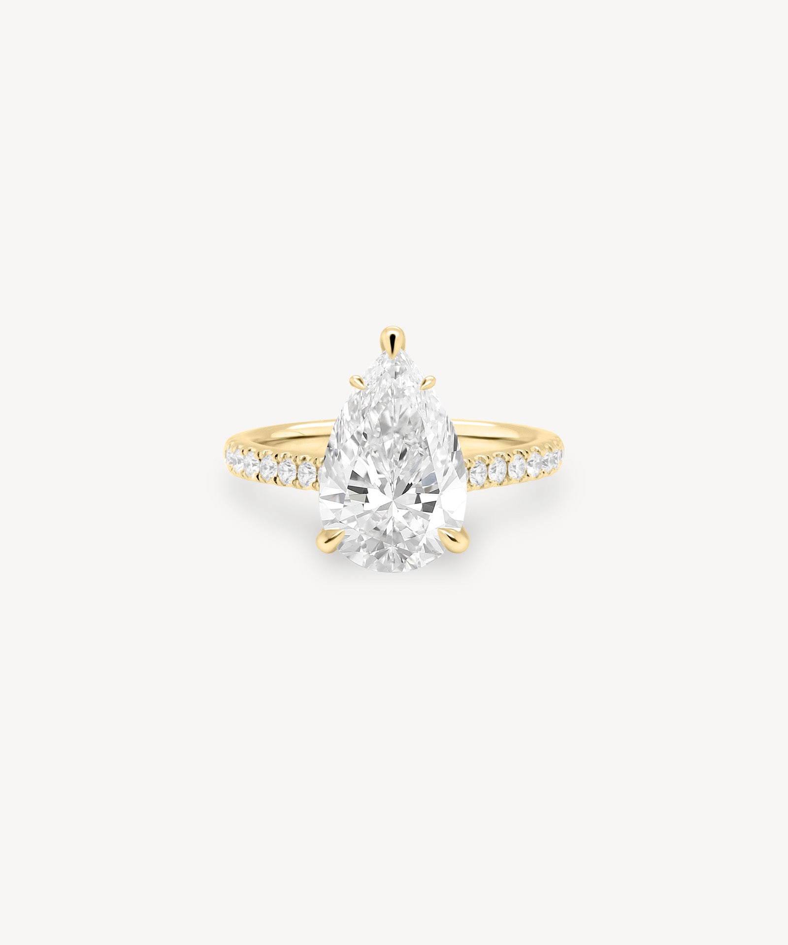 Pear Cut Diamond Pavé Ring in Cathedral Setting with Hidden Halo