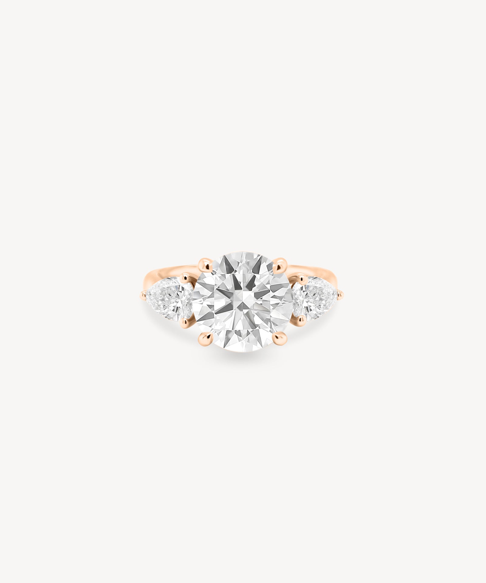 Round Cut Diamond Three Stone Ring With Pear Cut Side Stones