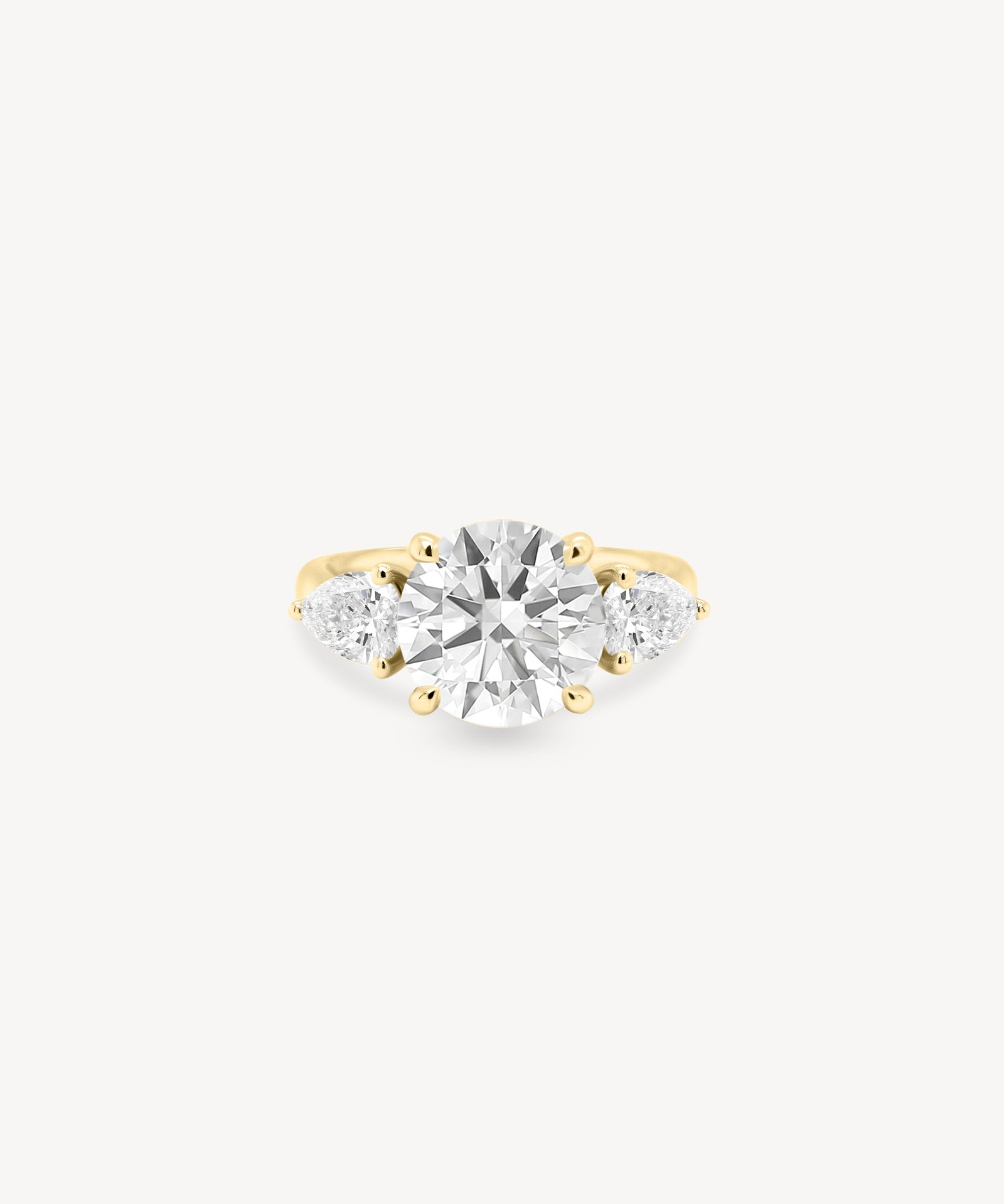 Round Cut Diamond Three Stone Ring With Pear Cut Side Stones