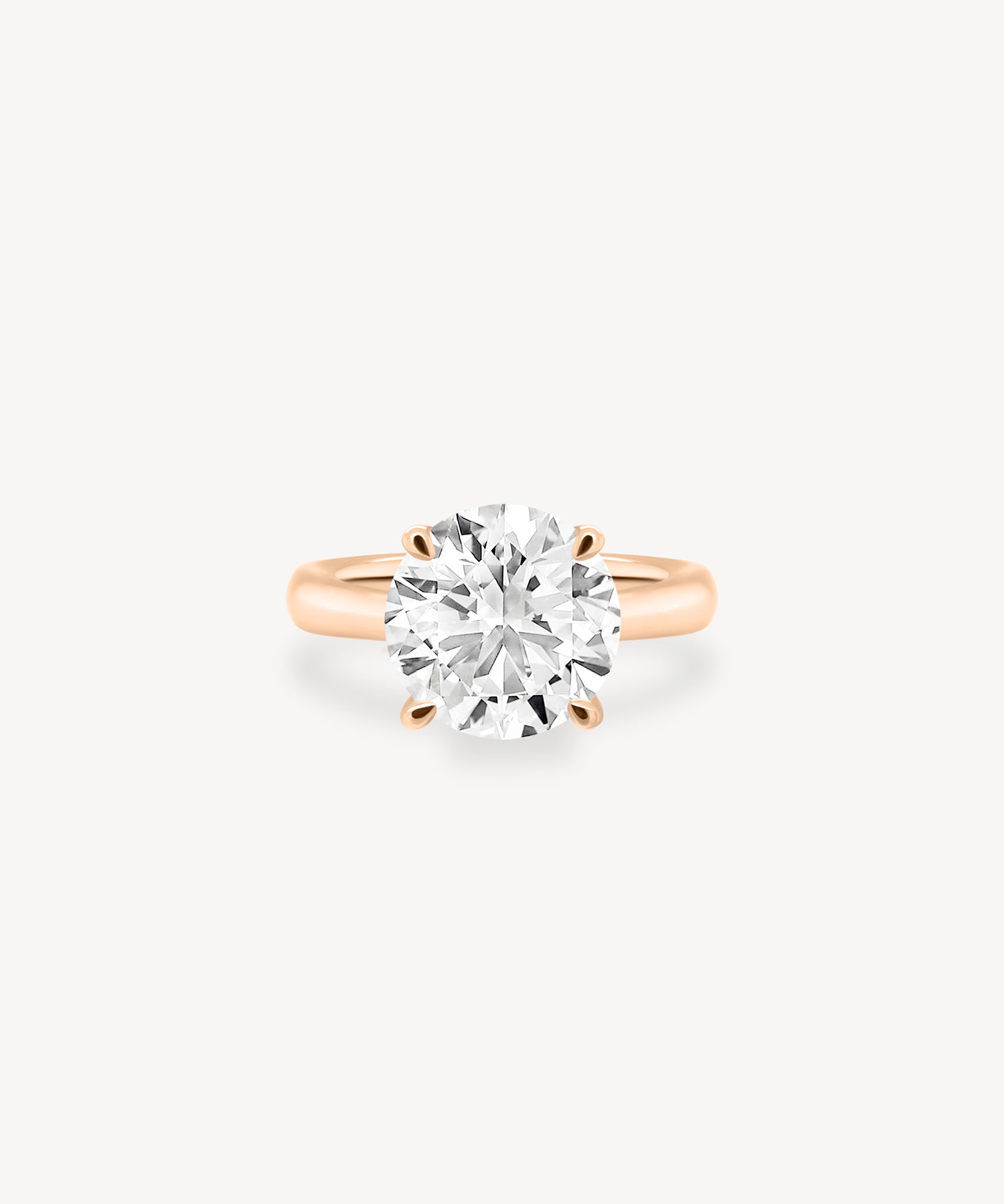 Classic Round Cut Diamond Solitaire Ring in Cathedral Setting