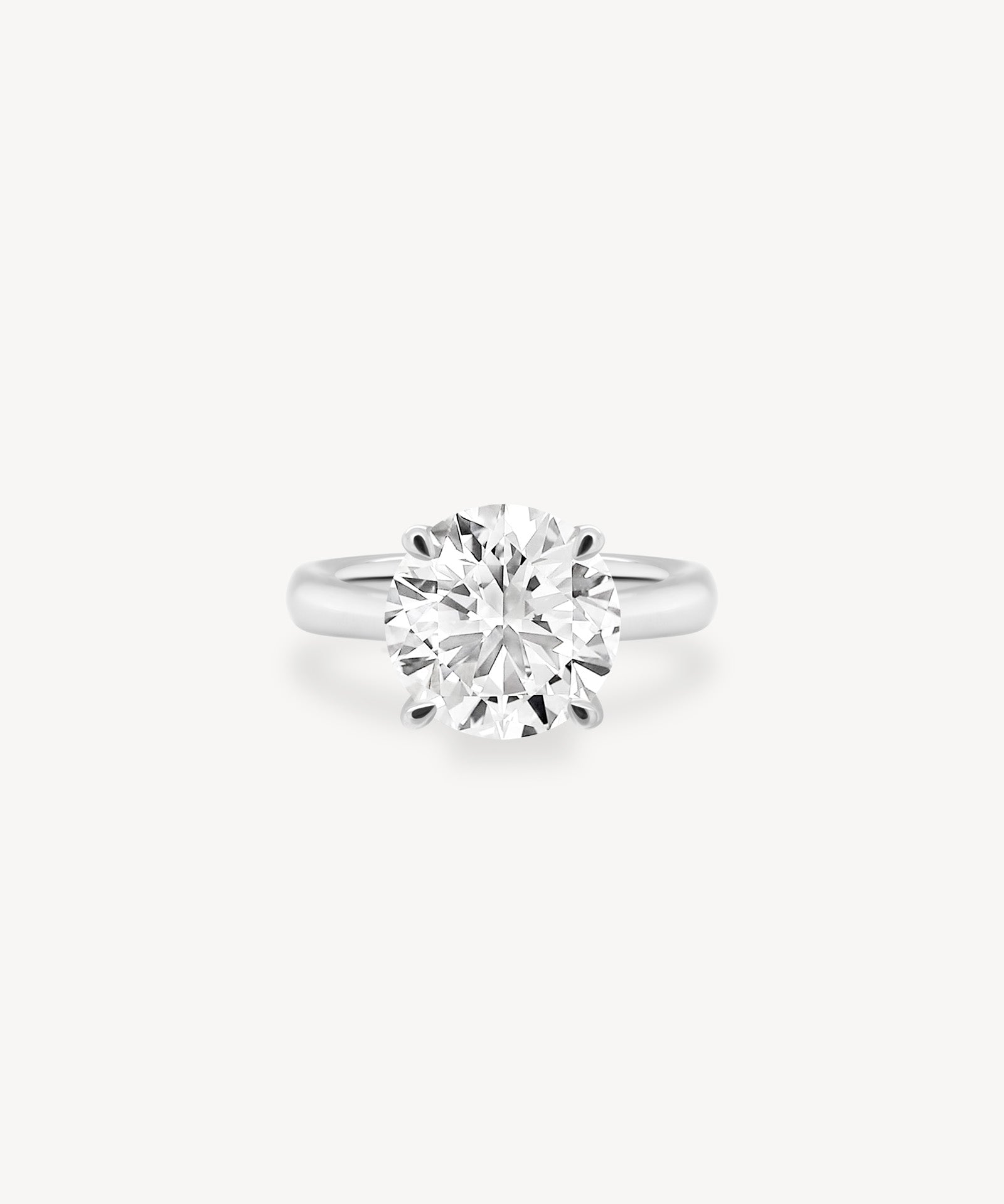 Classic Round Cut Diamond Solitaire Ring in Cathedral Setting