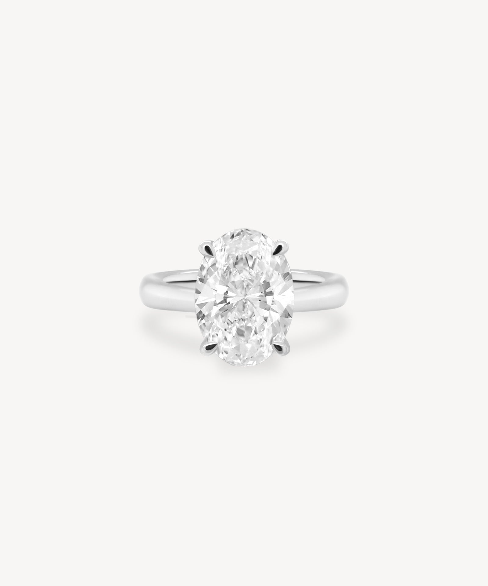 Classic Oval Cut Diamond Solitaire Ring in Cathedral Setting