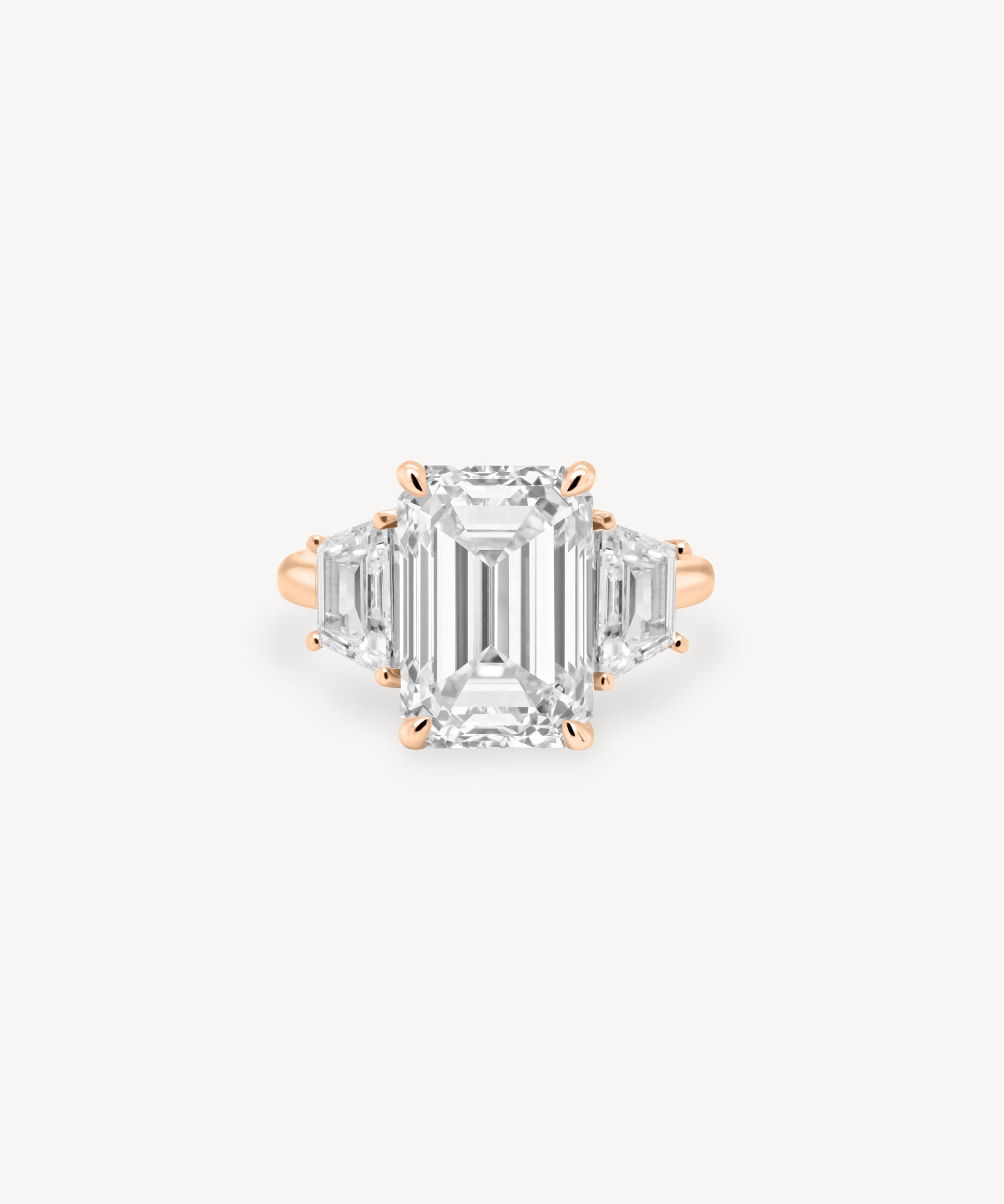 Emerald Cut Diamond Three Stone Ring With Trapezoid Cut Side Stones