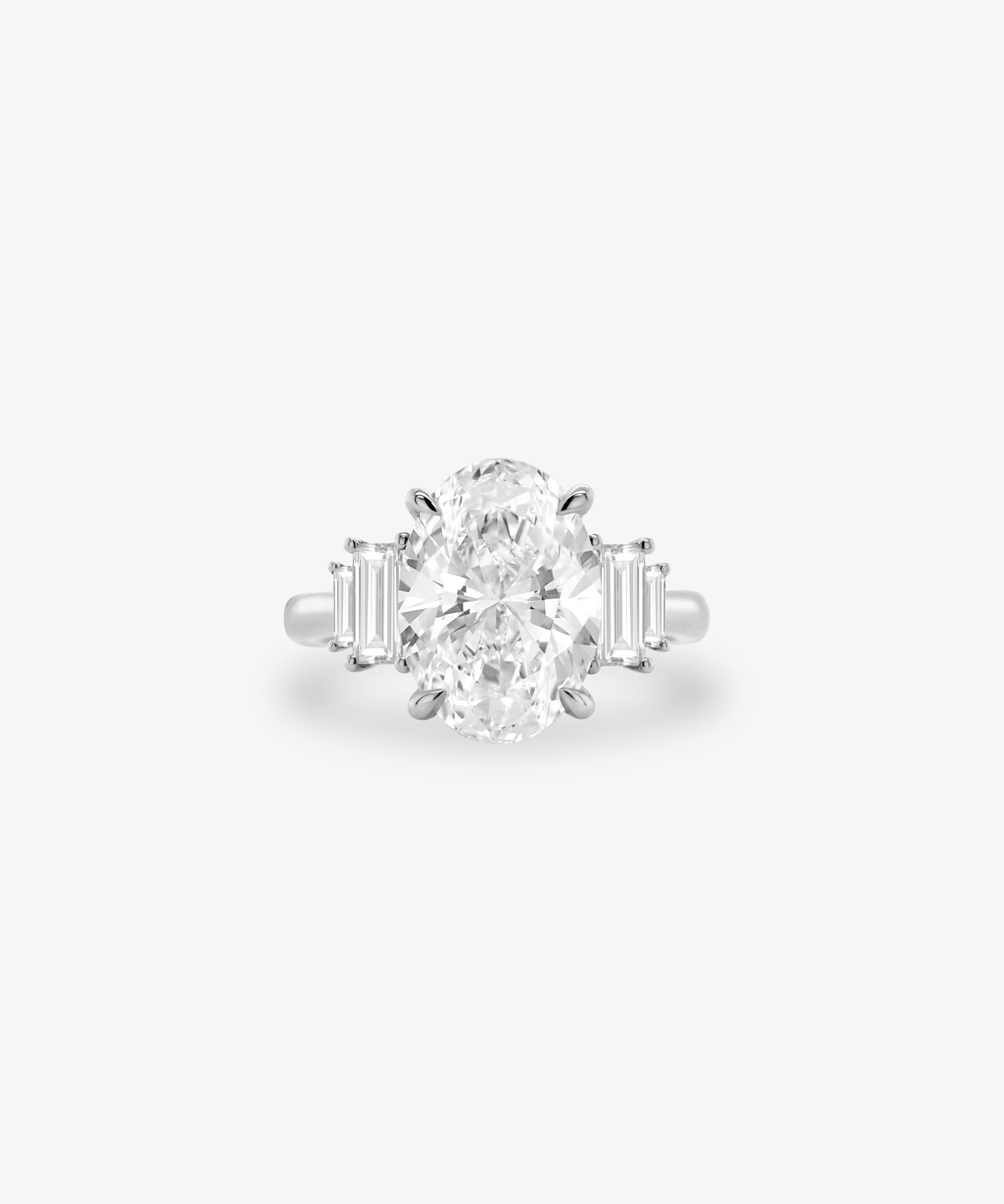 Oval Cut Diamond Ring with Graduated Baguette Side Stones