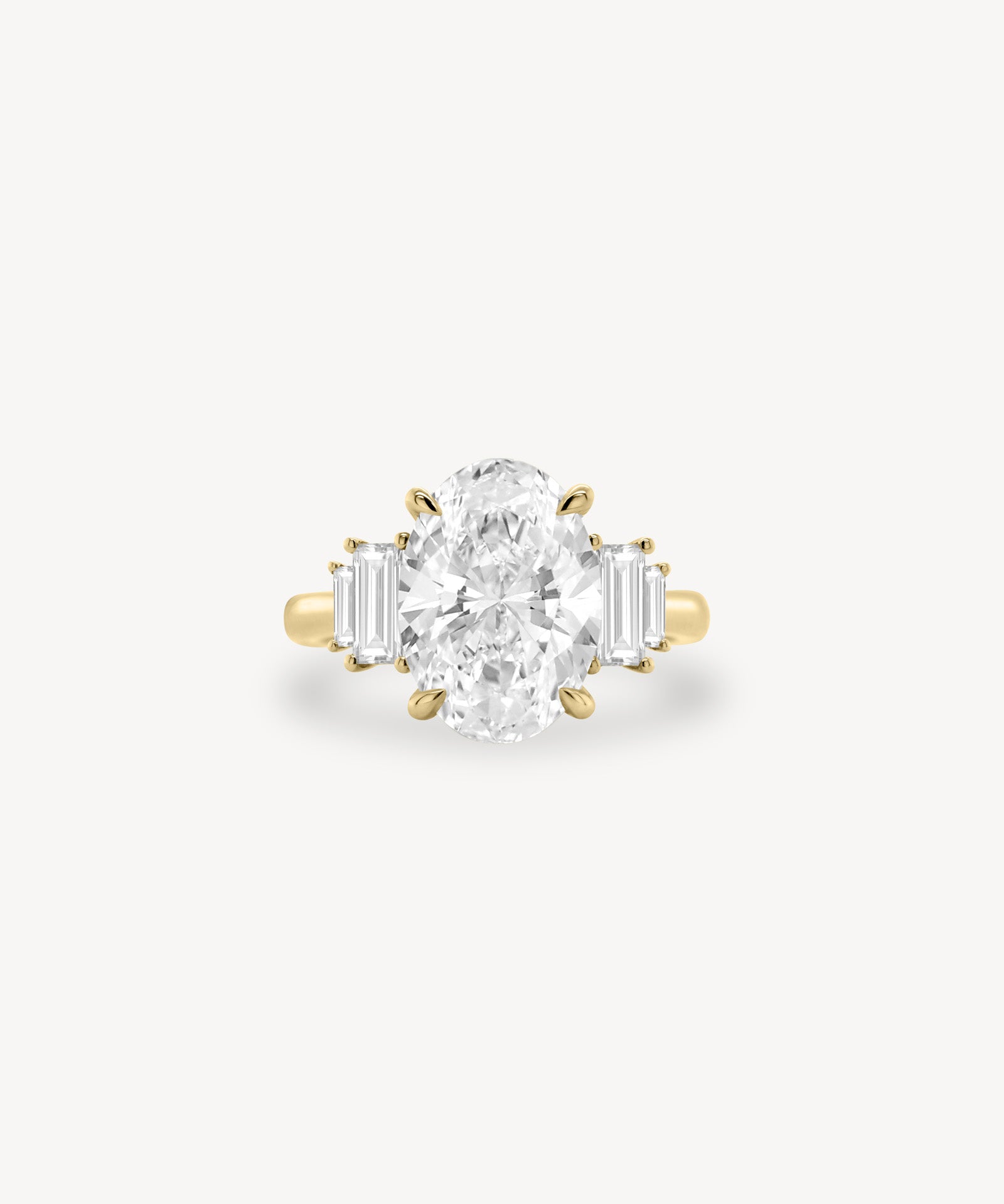 Oval Cut Diamond Ring with Graduated Baguette Side Stones
