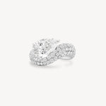 Pear cut diamond wave pavé dome ring in white gold